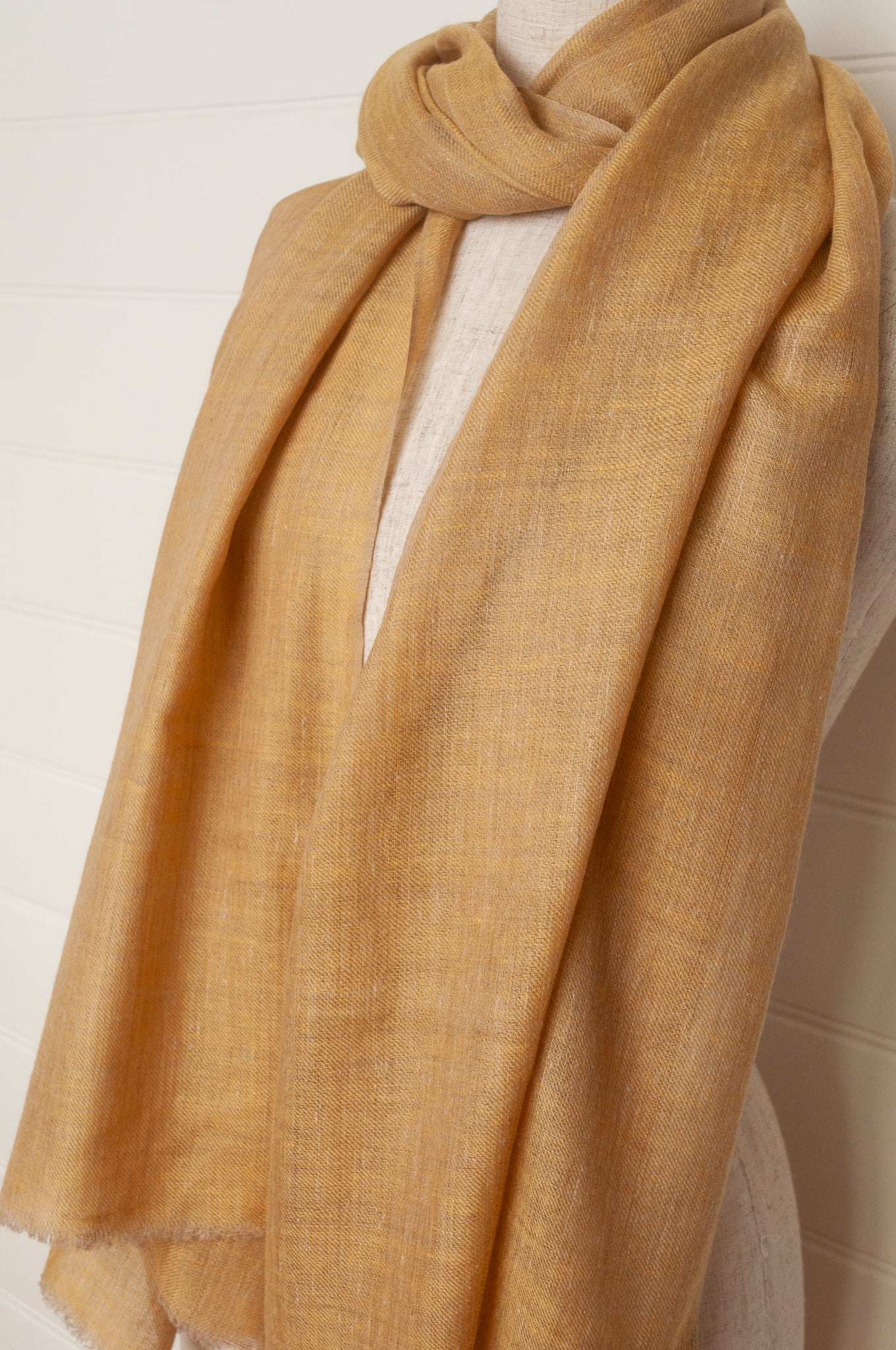 Pure pashmina cashmere wool handwoven scarf in soft gold.