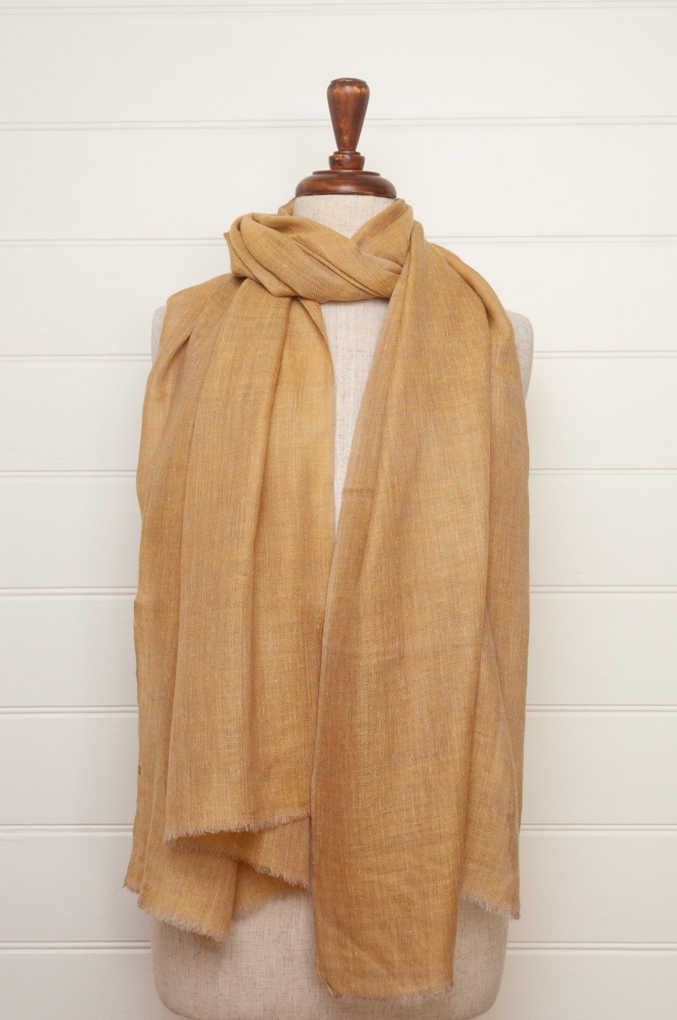 Pure pashmina cashmere wool handwoven scarf in soft gold.