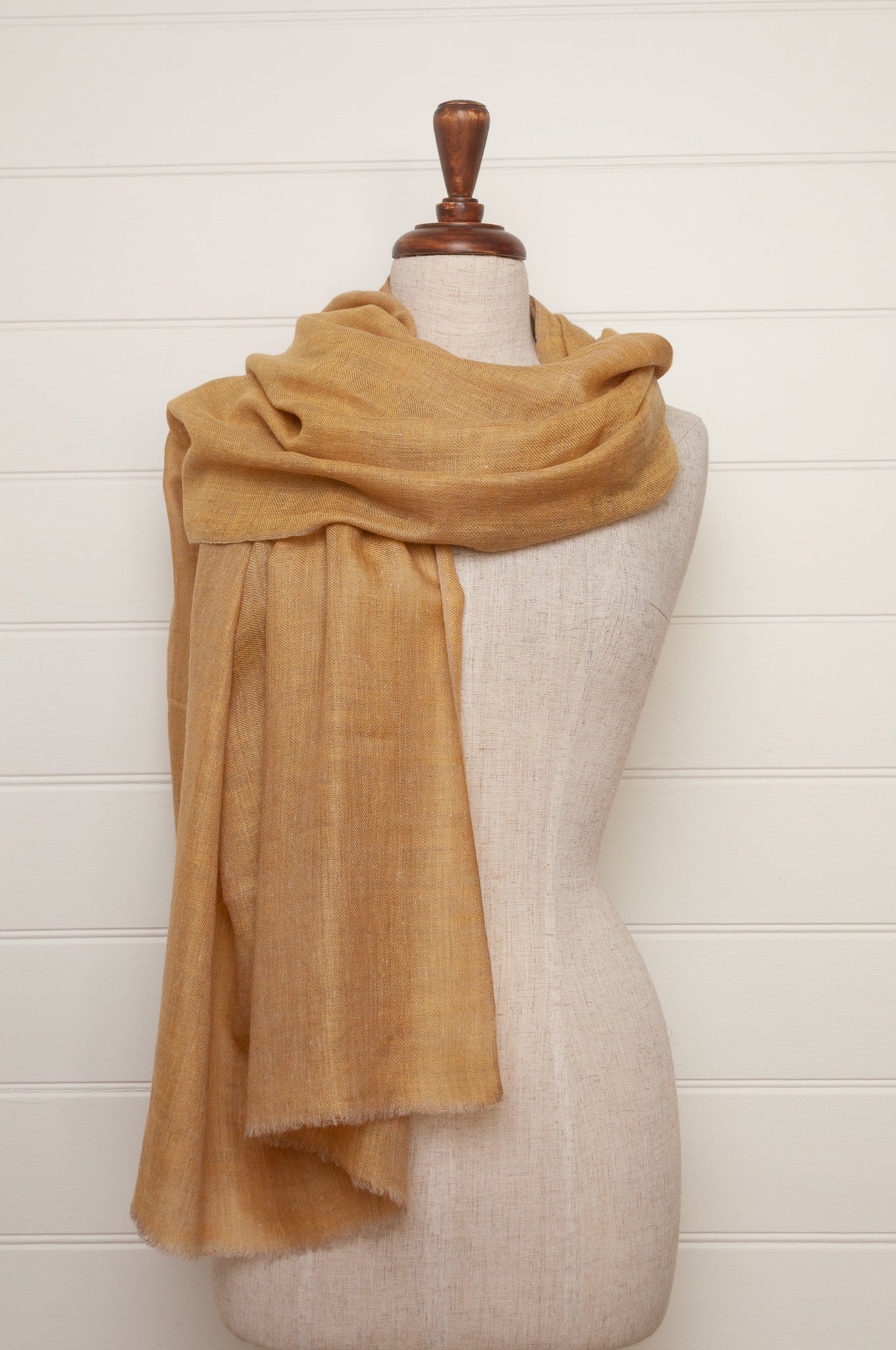 Pure pashmina cashmere wool handwoven scarf in soft gold.