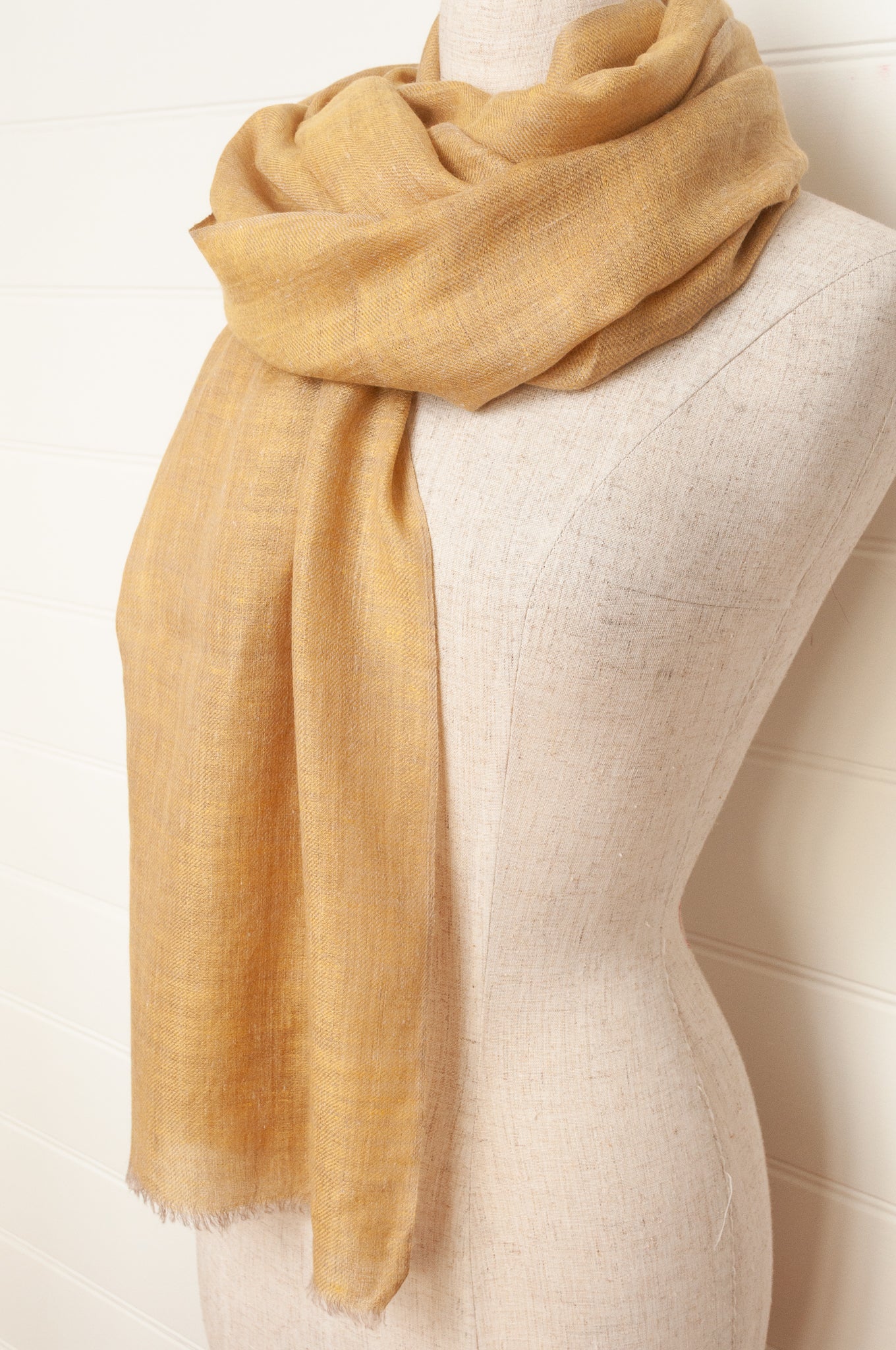 Pure pashmina cashmere wool handwoven scarf in soft gold.