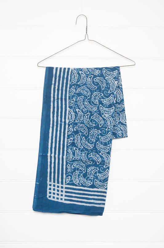 Blue and white indigo blockprint cotton sarong with crescent shapes and striped border.