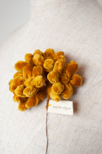 Classic handmade Sophie Digard jonquille flower brooch in mustard velvet.