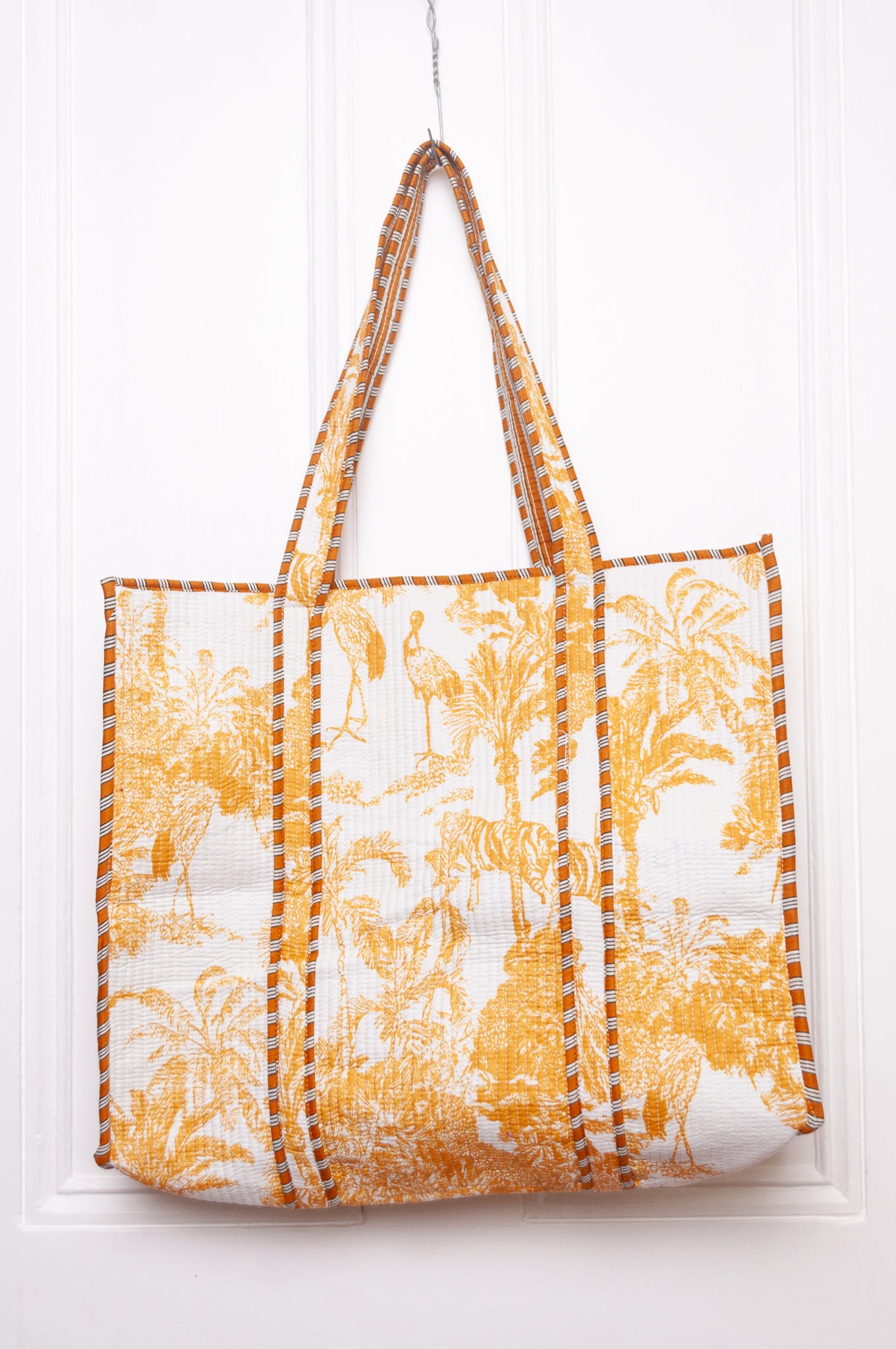 Mustard yellow and white toile de jouy quilted tote bag.