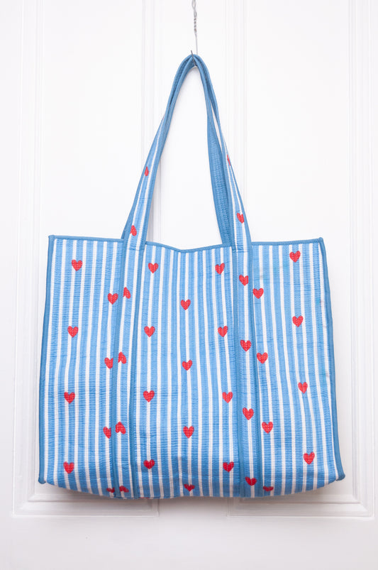 Blue and white striped with red hearts quilted tote bag.