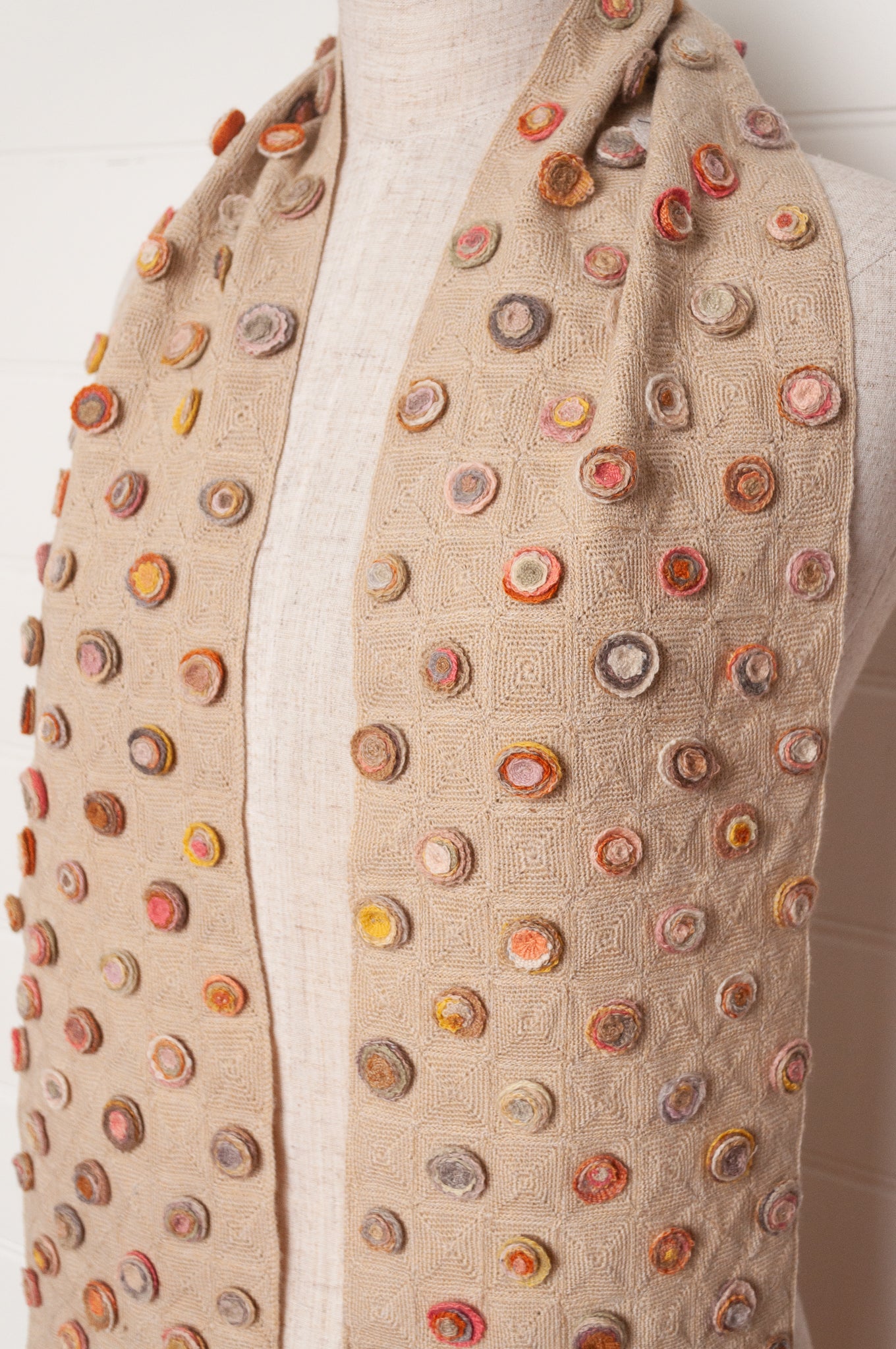 Sophie Digard crocehted scarf with warm toned small crocehted flower medallions on a neutral base.