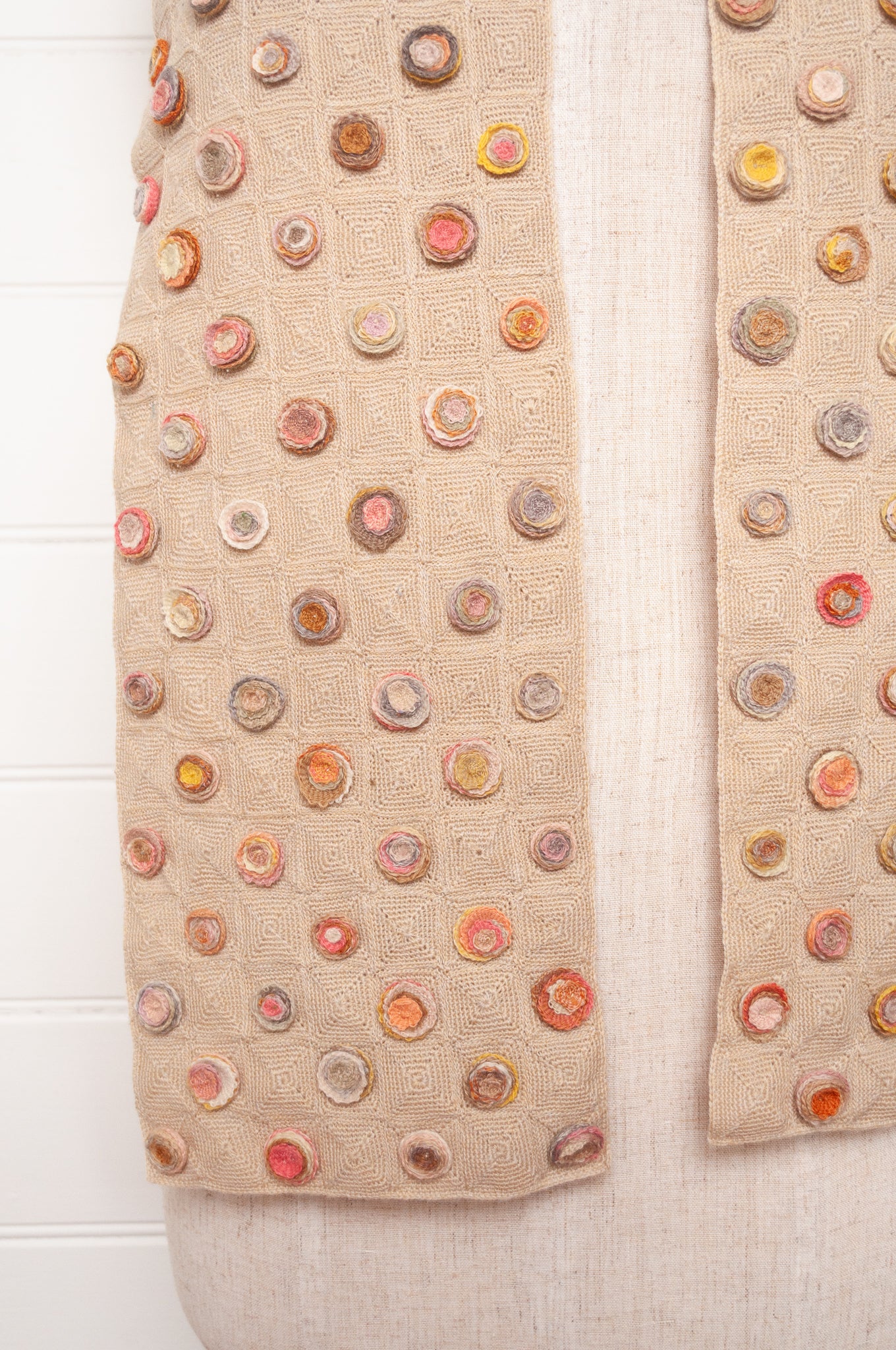 Sophie Digard crocehted scarf with warm toned small crocehted flower medallions on a neutral base.