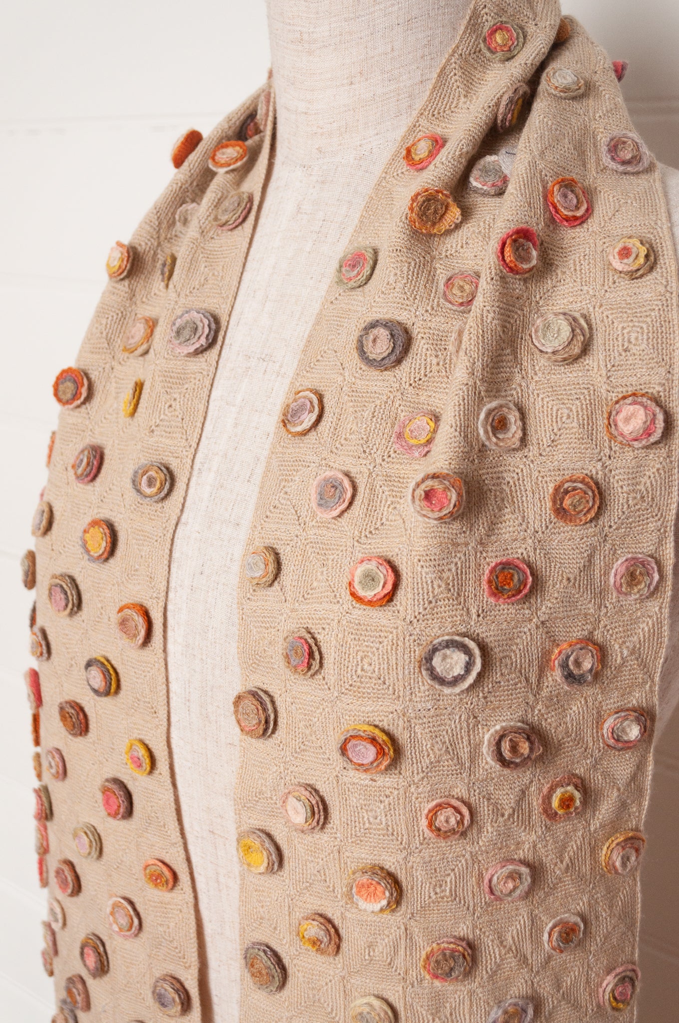 Sophie Digard crocehted scarf with warm toned small crocehted flower medallions on a neutral base.