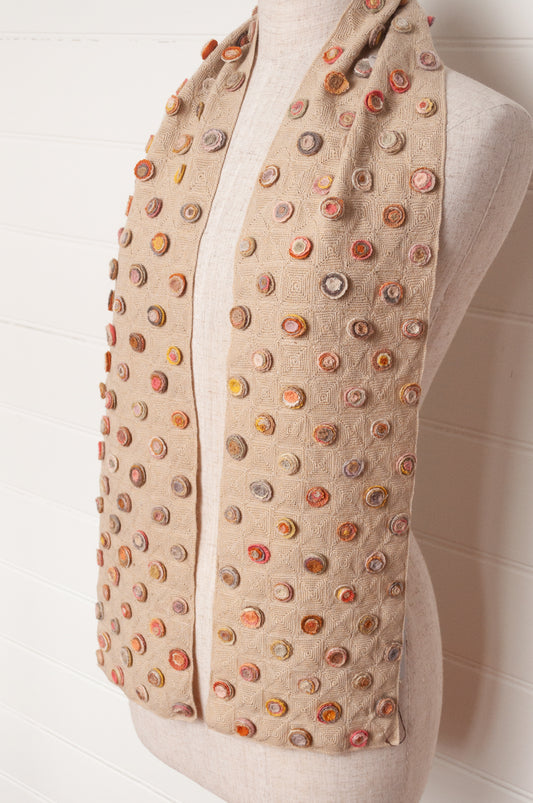 Sophie Digard crocehted scarf with warm toned small crocehted flower medallions on a neutral base.