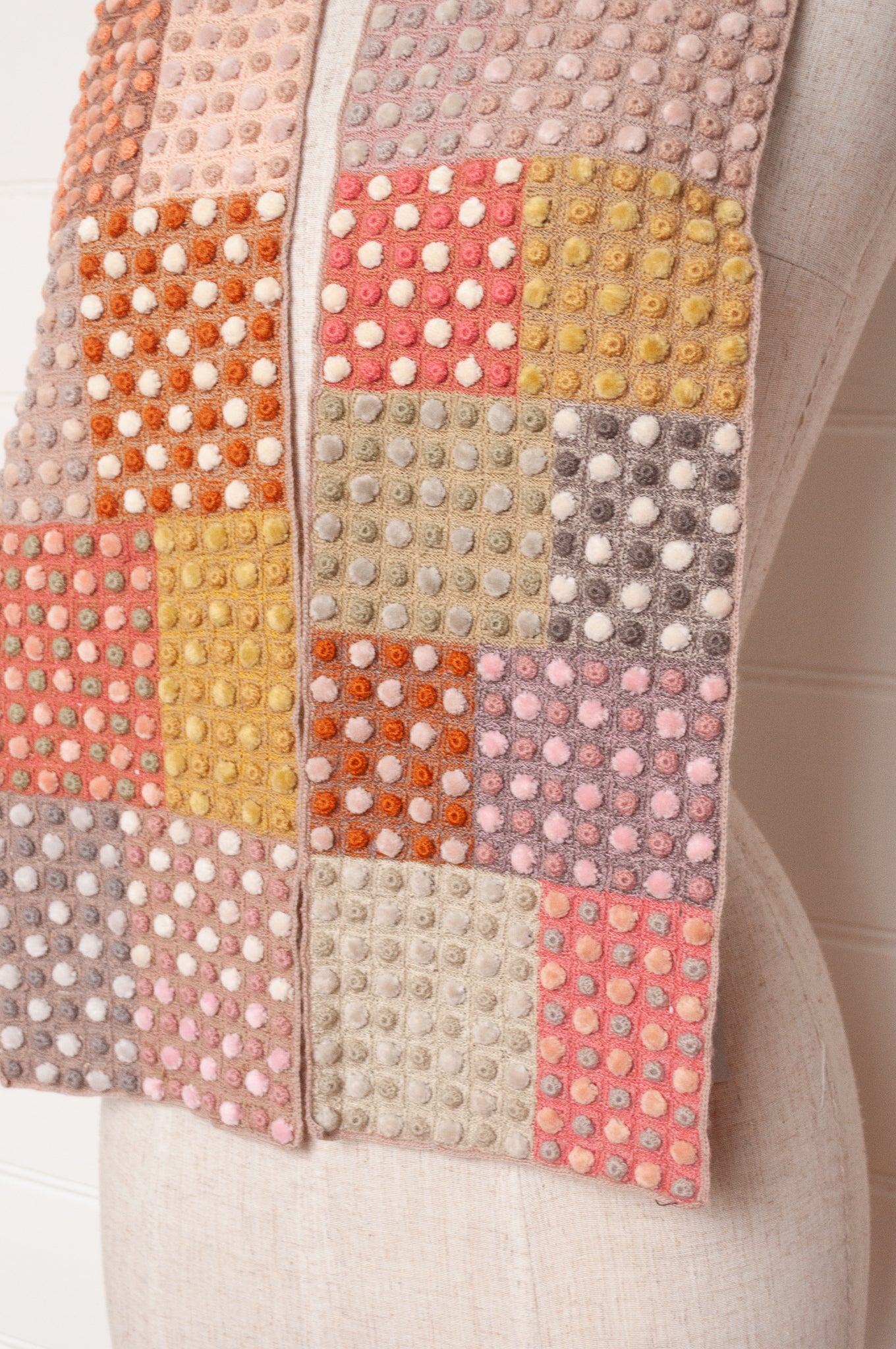 Sophie Digard crocehted scarf in warm tones, patchwork squares with small velvet spots.