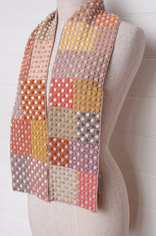Sophie Digard crocehted scarf in warm tones, patchwork squares with small velvet spots.