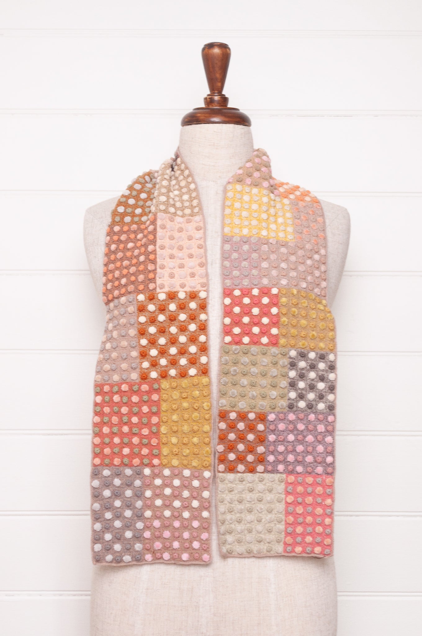 Sophie Digard crocehted scarf in warm tones, patchwork squares with small velvet spots.