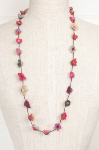 Classic Sophie Digard handmade necklace is a string of beautiful linen embroidered flowers in pink, red, olive and taupe.