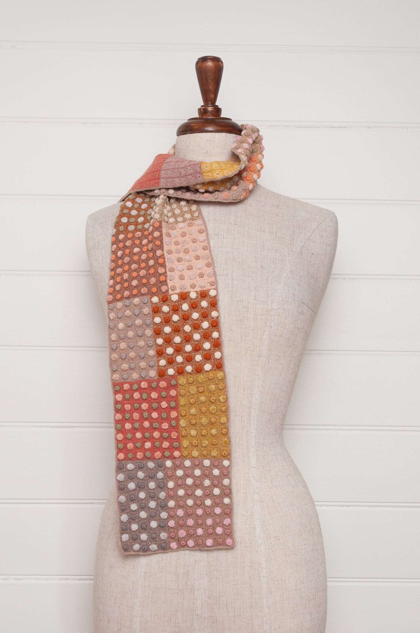 Sophie Digard crocehted scarf in warm tones, patchwork squares with small velvet spots.