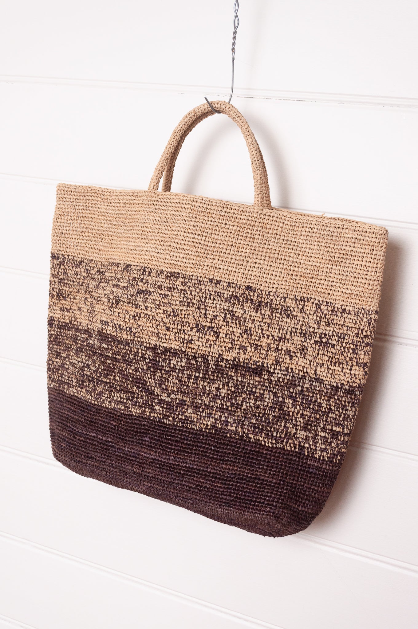 Sophie Digard crochet raffia shopper tote bag in gradient stripes from dark mole brown to natural flax.