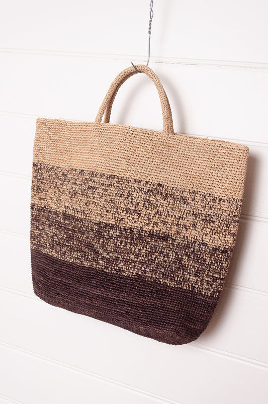 Sophie Digard crochet raffia shopper tote bag in gradient stripes from dark mole brown to natural flax.