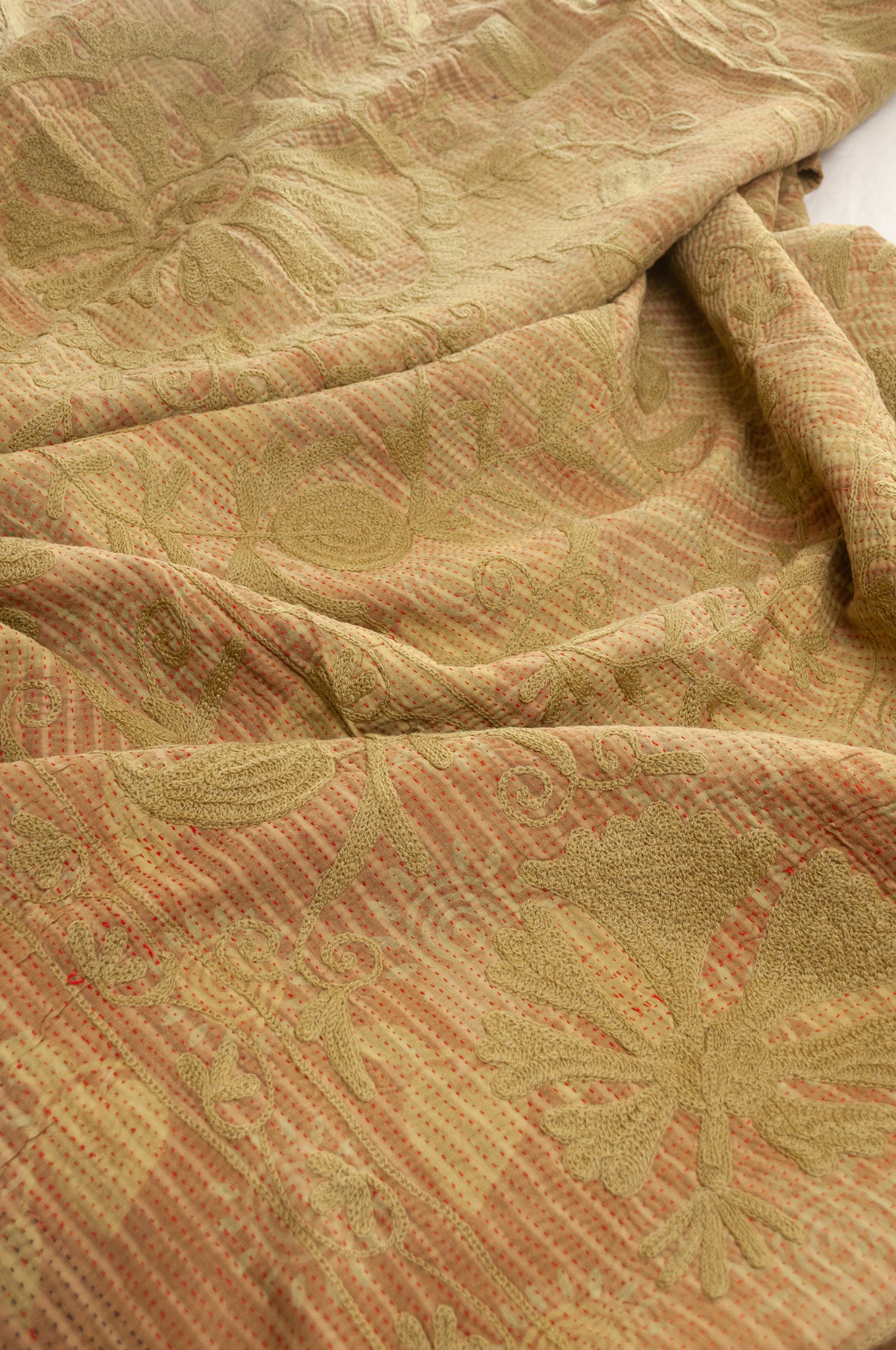 Vintage kantha quilt embroidered Suzani style floral design in olive on mustard stripes.