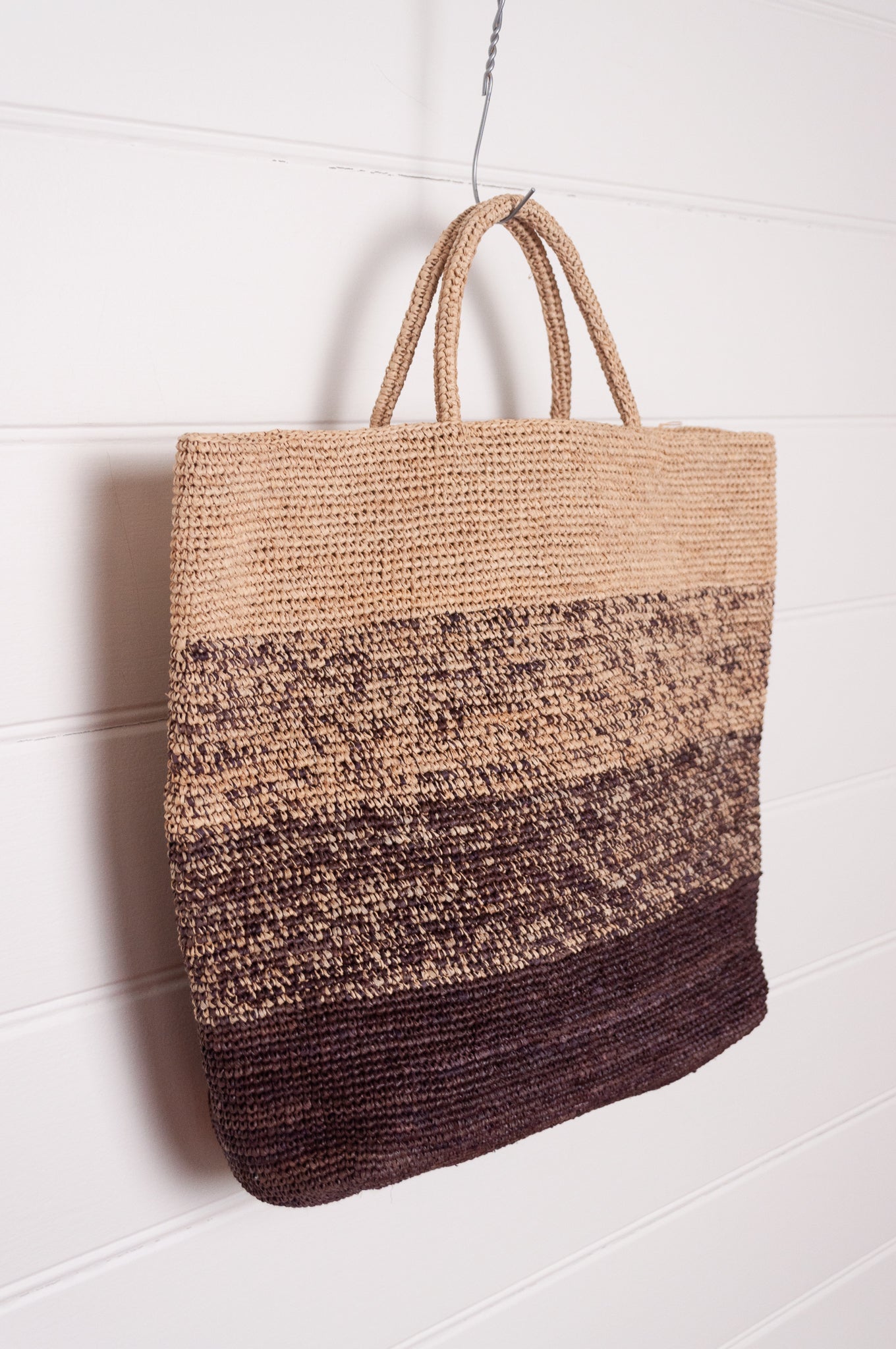 Sophie Digard crochet raffia shopper tote bag in gradient stripes from dark mole brown to natural flax.