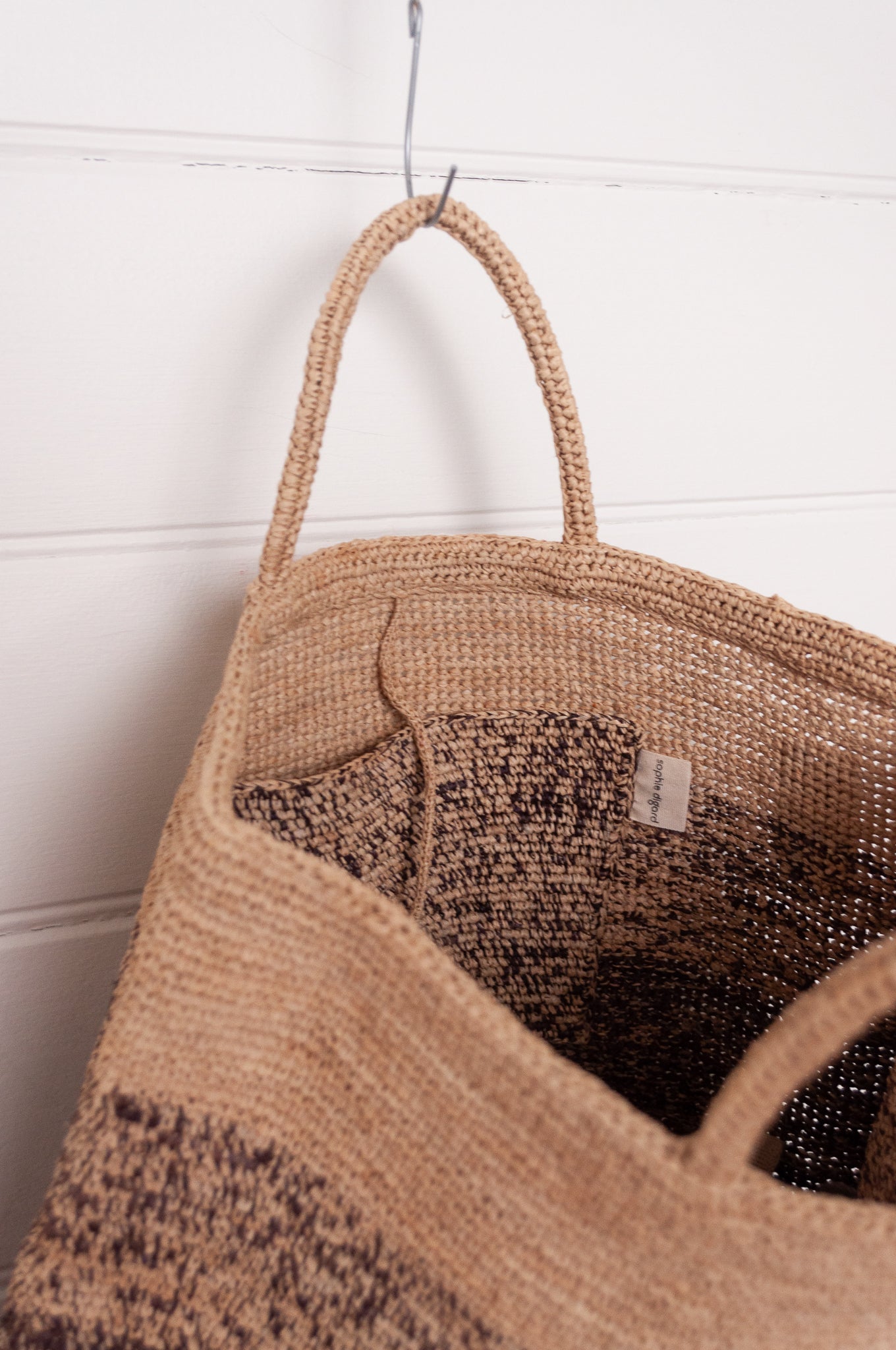Sophie Digard crochet raffia shopper tote bag in gradient stripes from dark mole brown to natural flax.