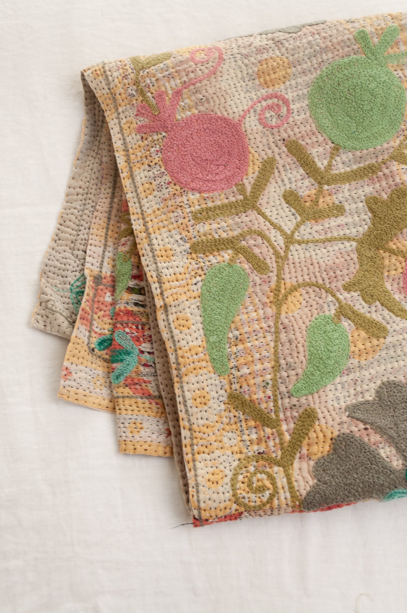 Suzani embroidered vintage kantha quilt floral design in pink, teal, aqua and mustard.