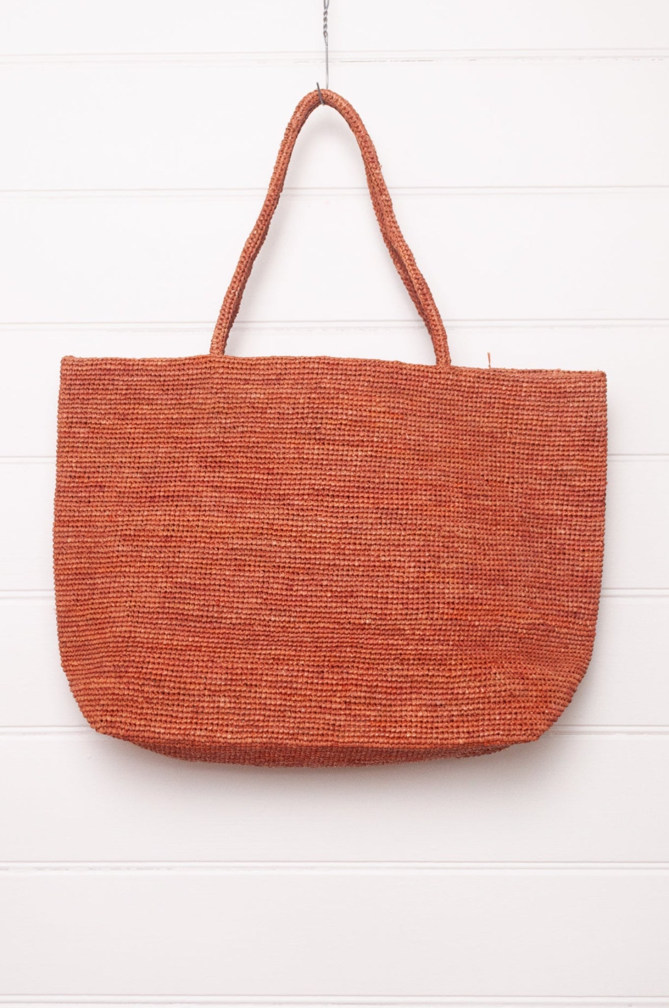 Sophie Digard large crochet raffia bag in ember rust brown.