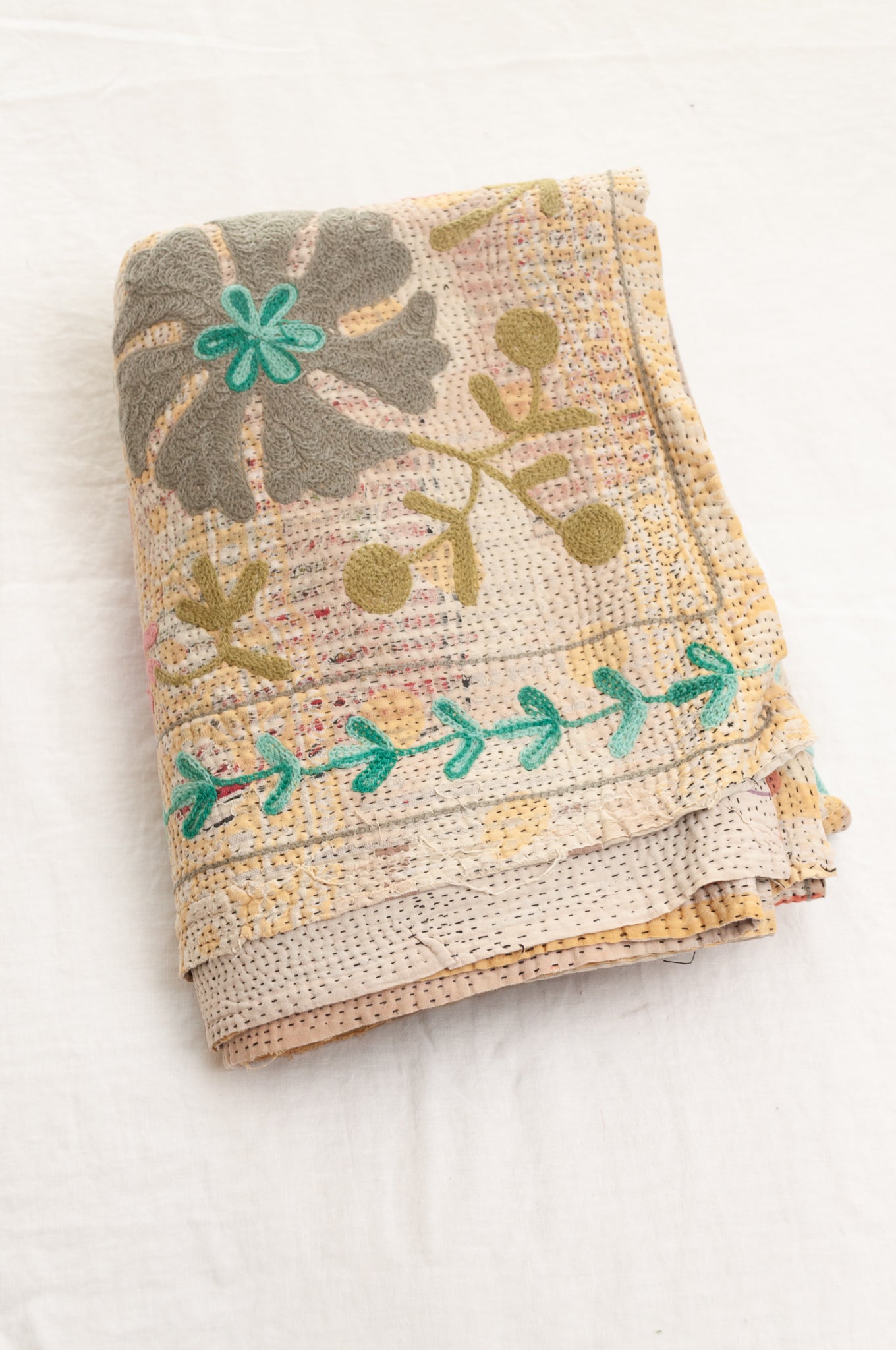 Suzani embroidered vintage kantha quilt floral design in pink, teal, aqua and mustard.