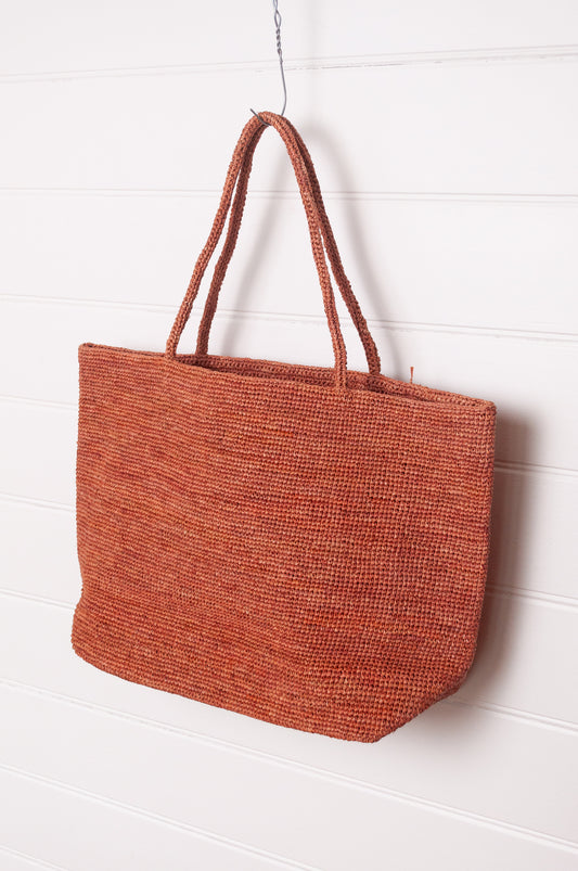 Sophie Digard large crochet raffia bag in ember rust brown.