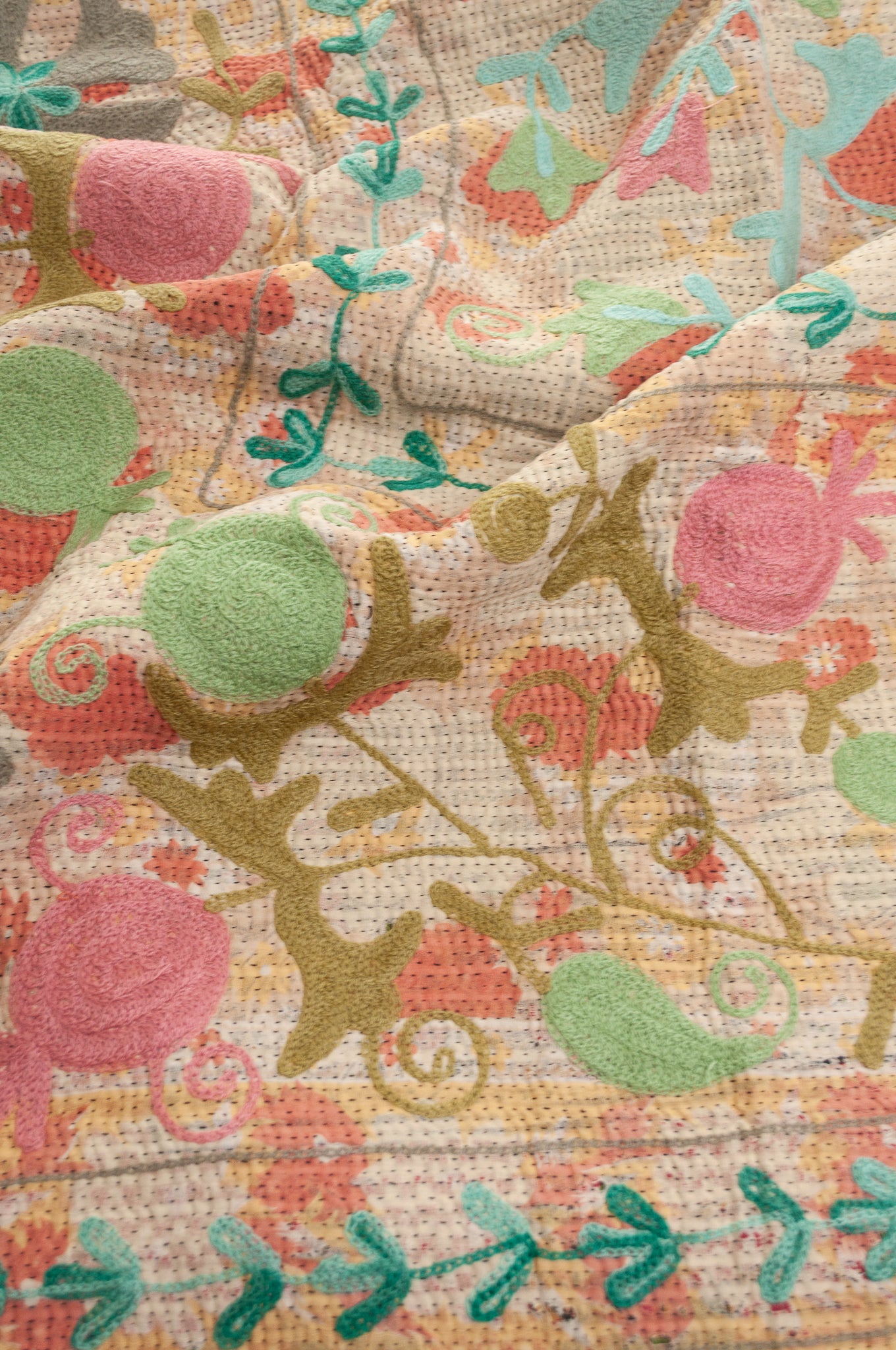 Suzani embroidered vintage kantha quilt floral design in pink, teal, aqua and mustard.