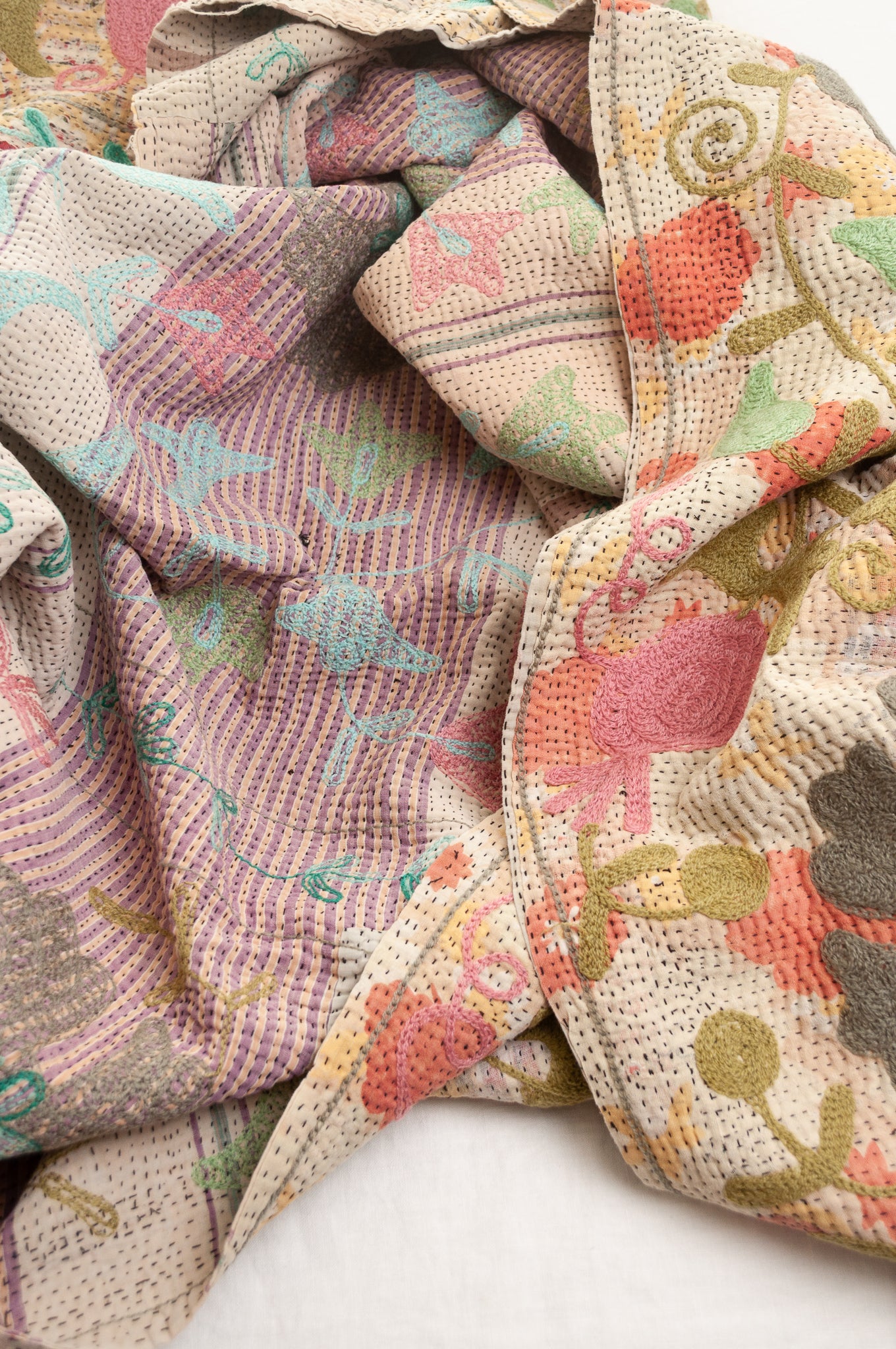 Suzani embroidered vintage kantha quilt floral design in pink, teal, aqua and mustard.