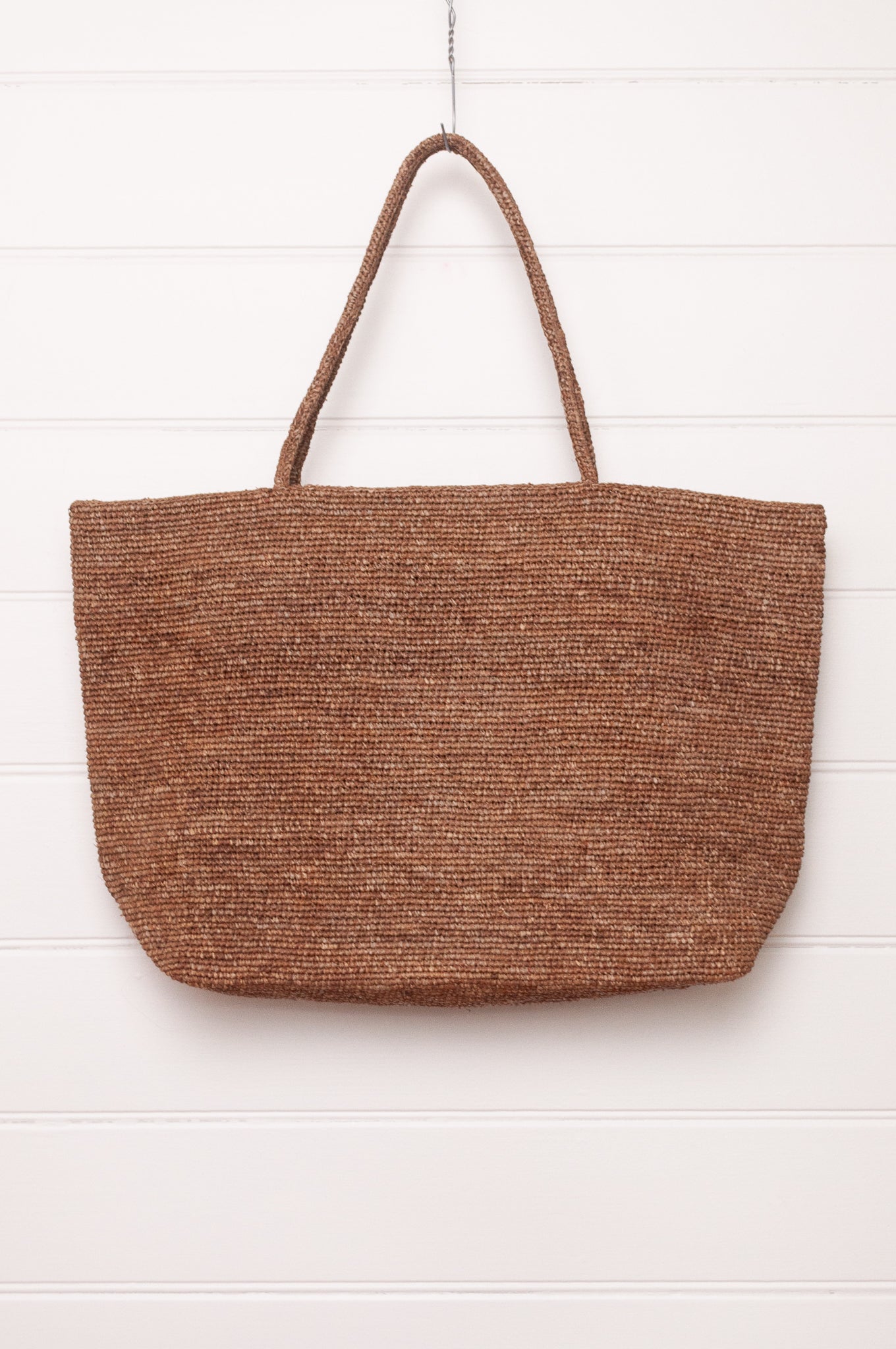 Sophie Digard large crochet raffia bag in terre d'ombre umber brown.