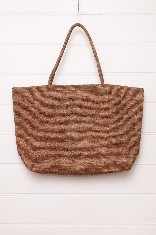 Sophie Digard large crochet raffia bag in terre d'ombre umber brown.