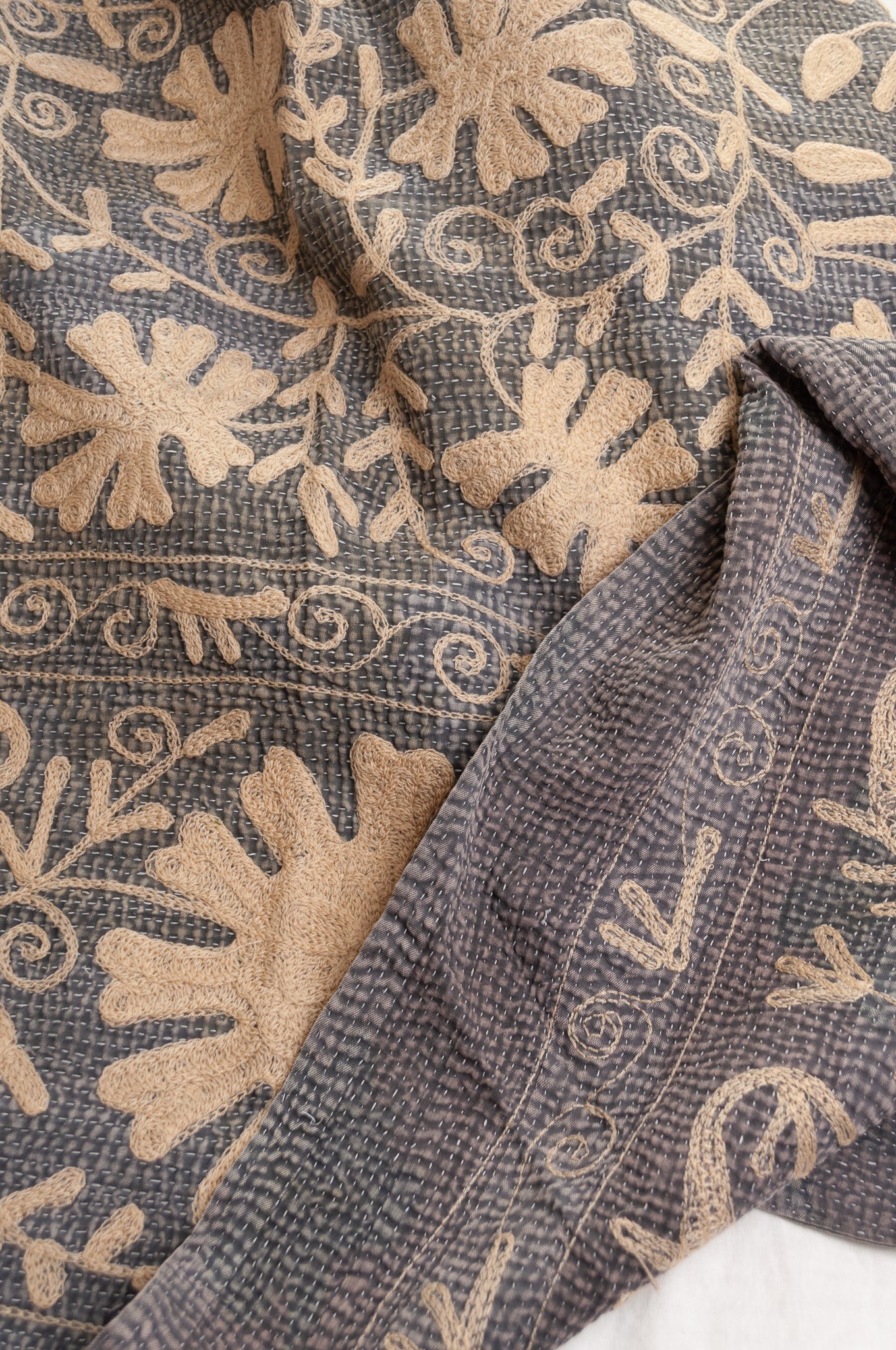 Suzani embroidered vintage kantha quilt floral design in pewter grey with vanilla cream embroidery.