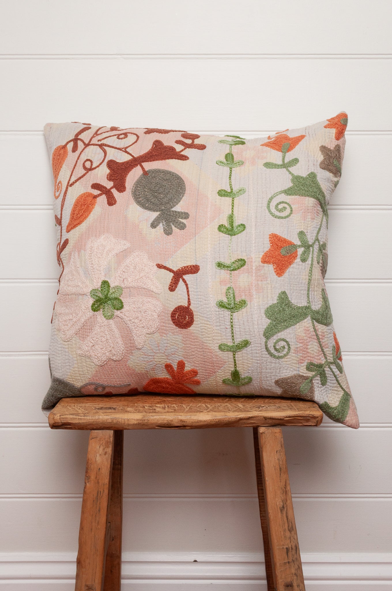 Suzani embroidered vintage kantha bolster cushion floral in mustard, teal green and rust.