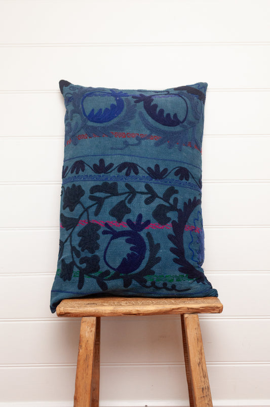 Suzani embroidered vintage indigo quilt, floral design in deep indigo and cobalt blue on indigo base with red highlights.