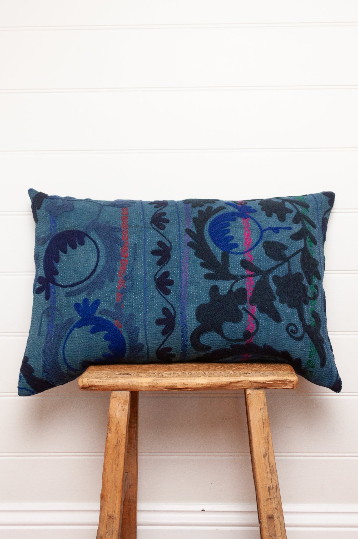 Suzani embroidered vintage indigo quilt, floral design in deep indigo and cobalt blue on indigo base with red highlights.