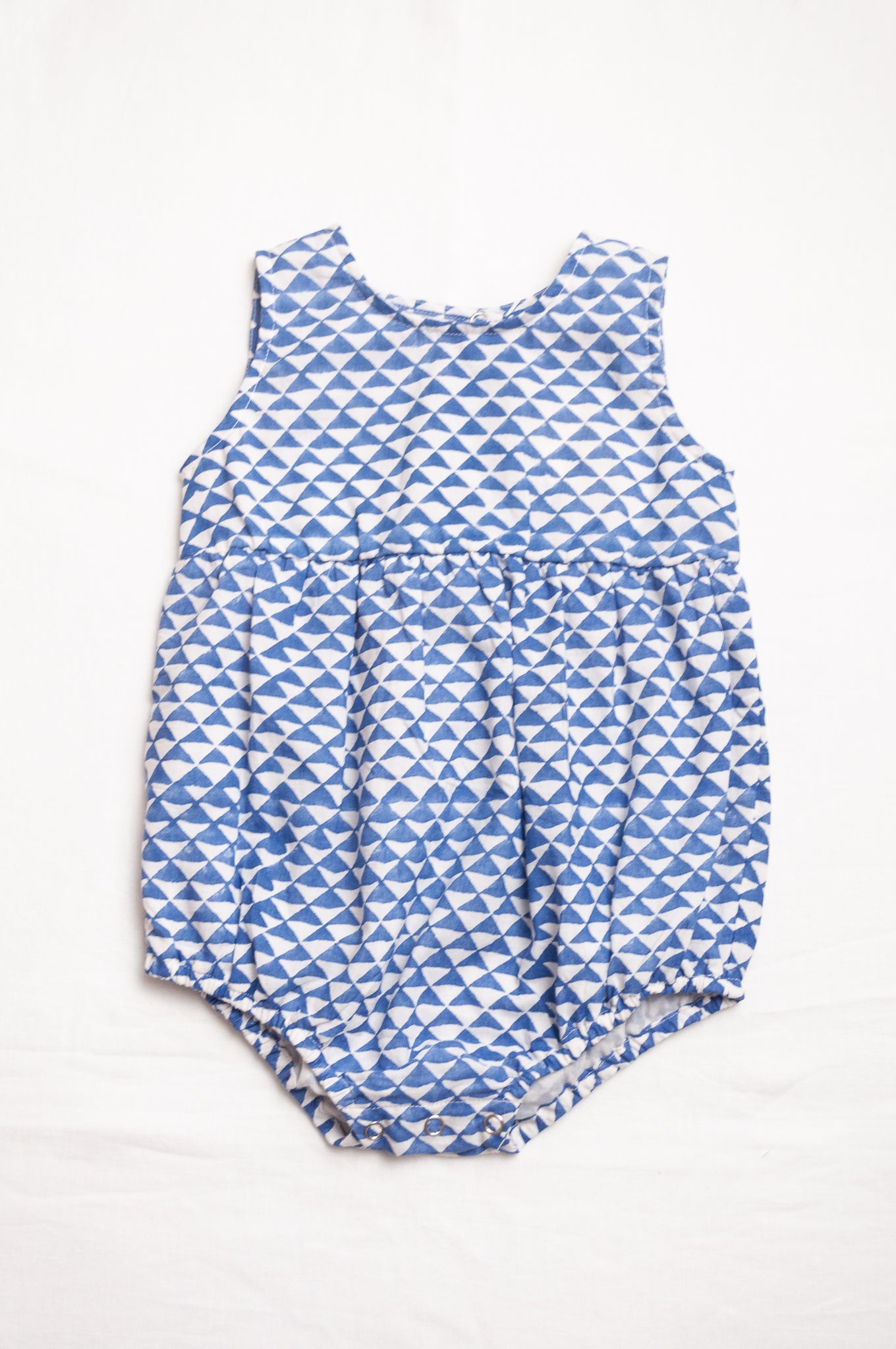 Juni Kids pure cotton blockprint baby romper in cobalt blue triangles on white.