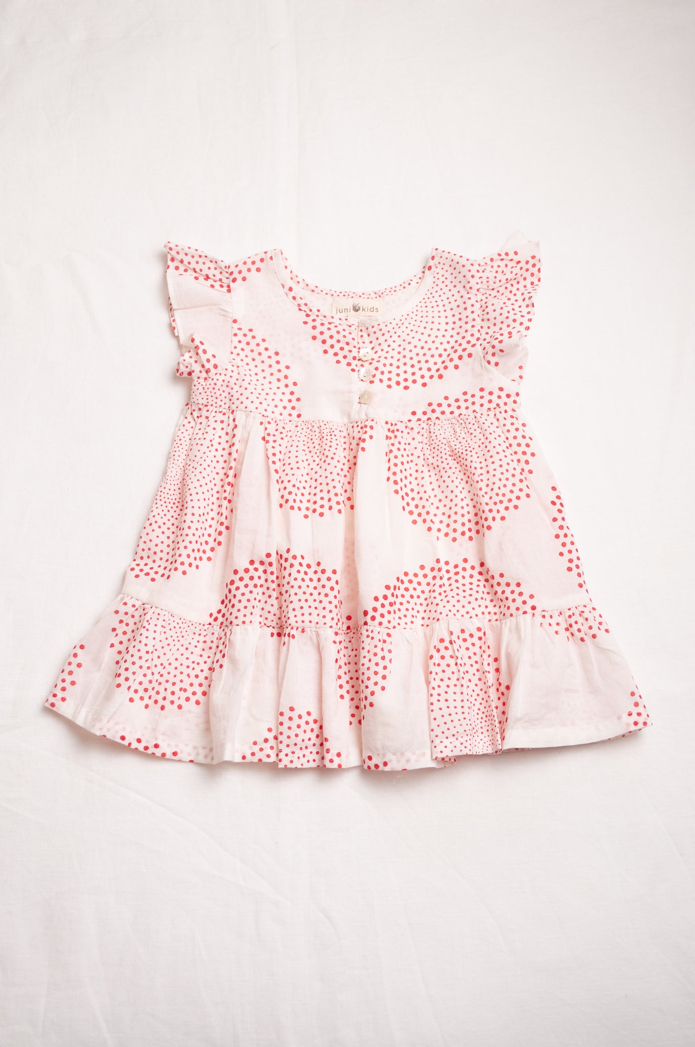 Juni Kids pure cotton blockprint baby dress in red circle dots on white.