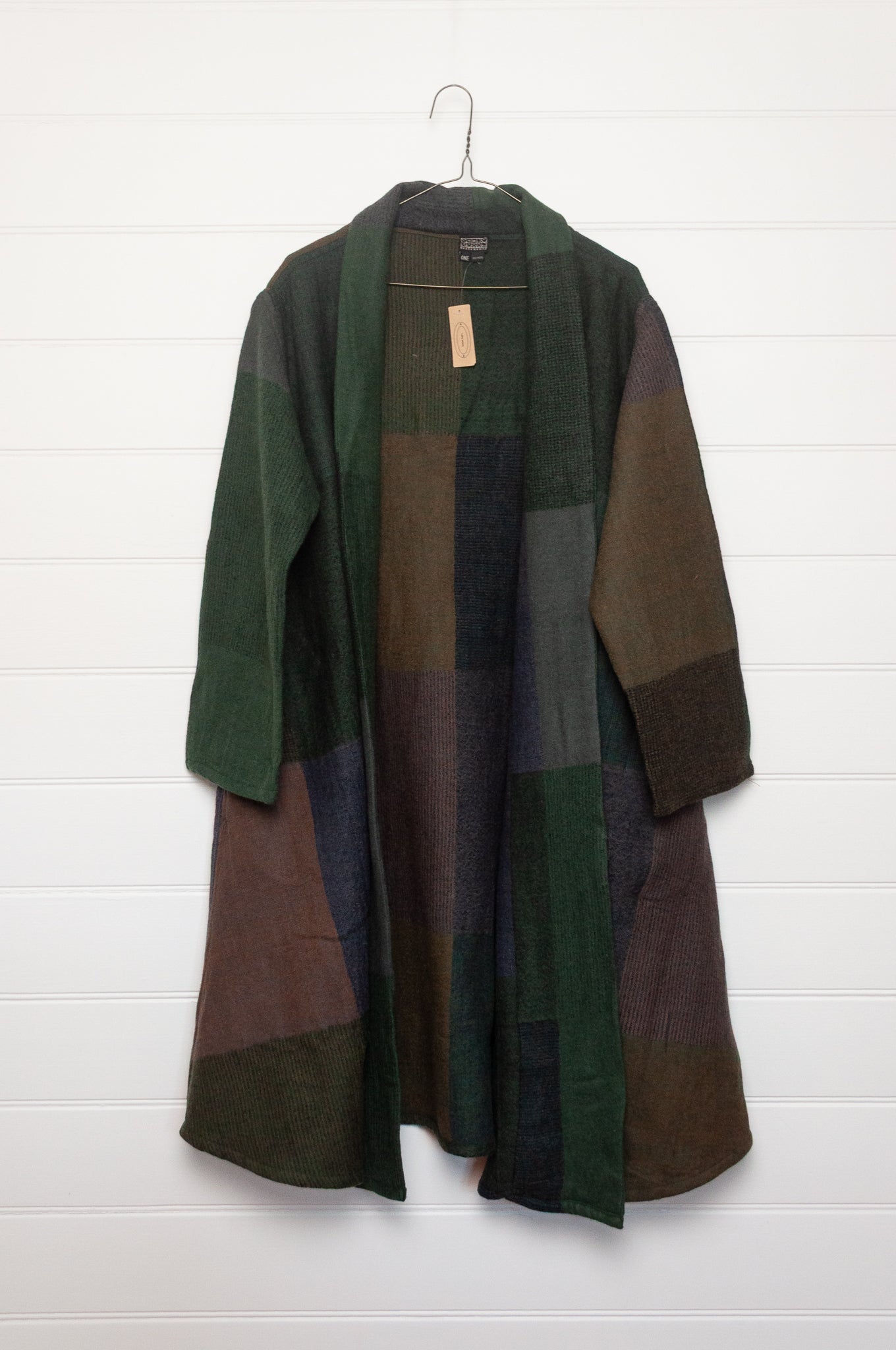 Neeru Kumar handwoven wool cardigan jacket coat in multicolor block pattern of browns and greens.