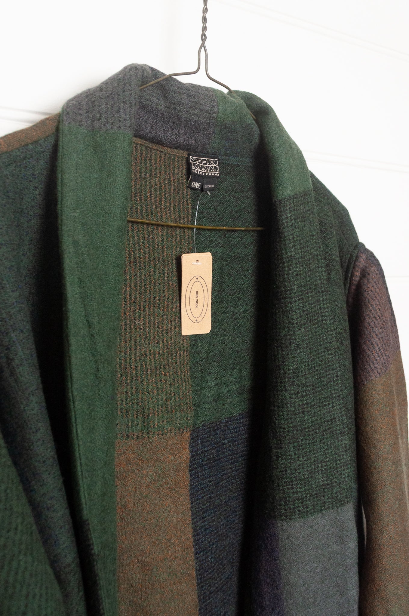 Neeru Kumar handwoven wool cardigan jacket coat in multicolor block pattern of browns and greens.