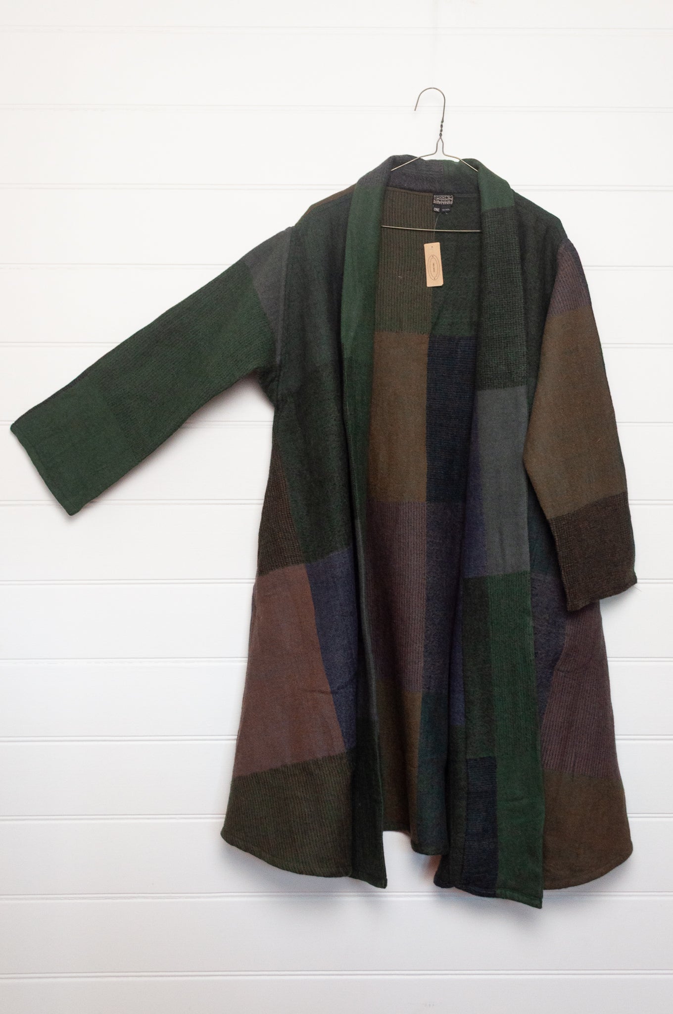 Neeru Kumar handwoven wool cardigan jacket coat in multicolor block pattern of browns and greens.
