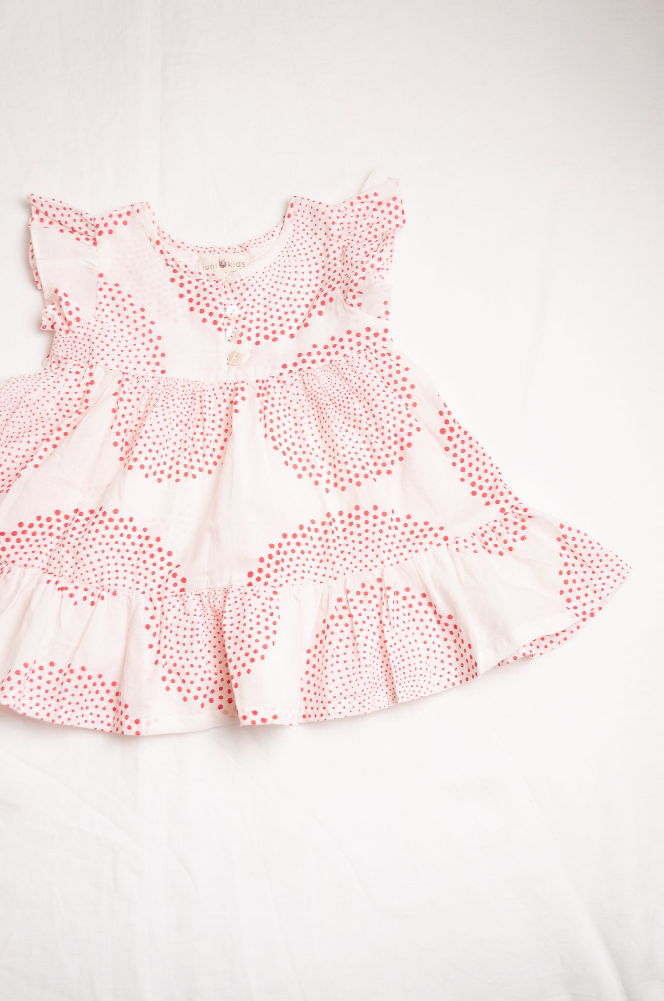 Juni Kids pure cotton blockprint baby dress in red circle dots on white.