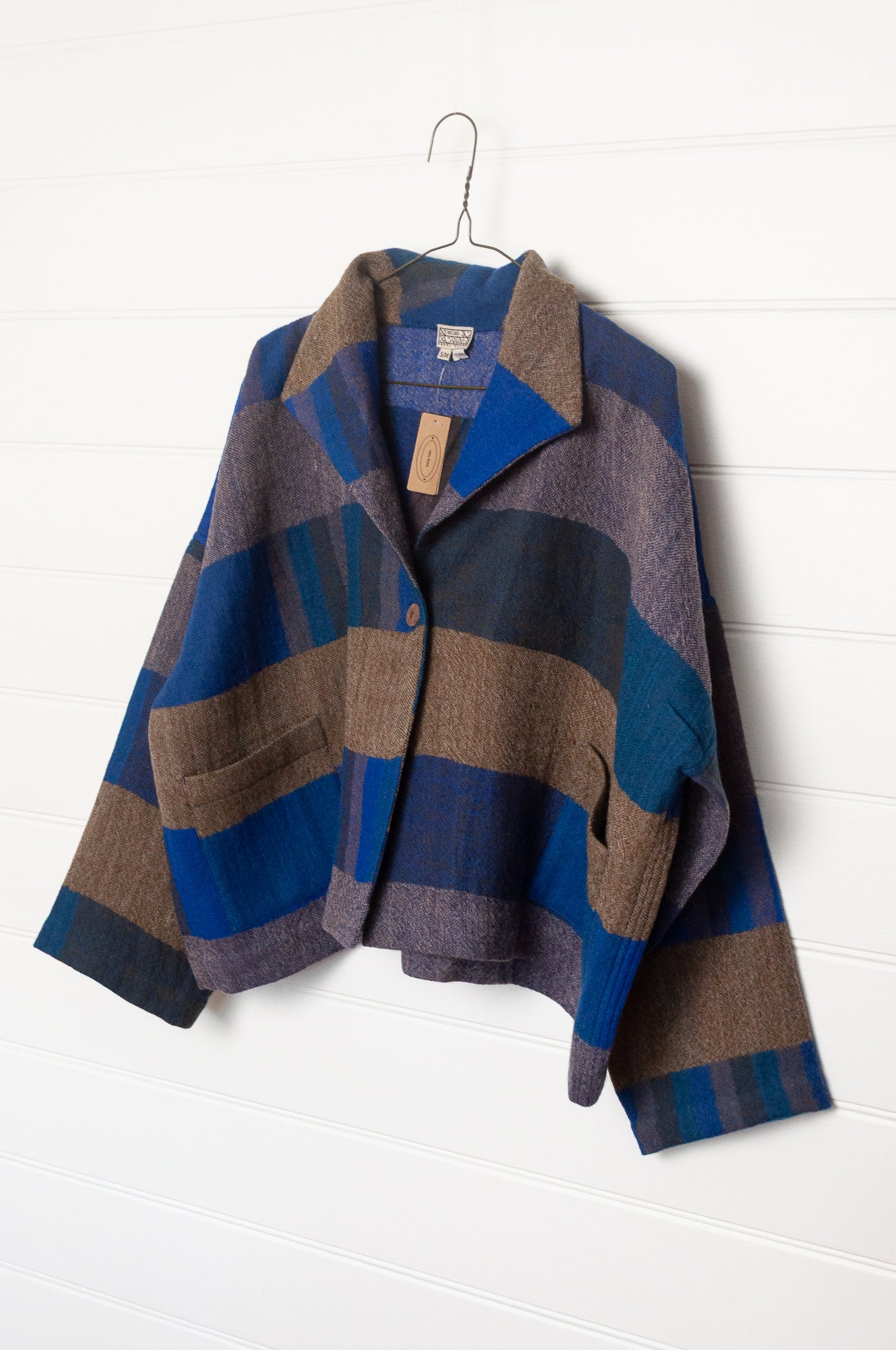 Neeru Kumar handwoven wool Coco jackt in block blanket checks in grey brown, cobalt, teal and navy.
