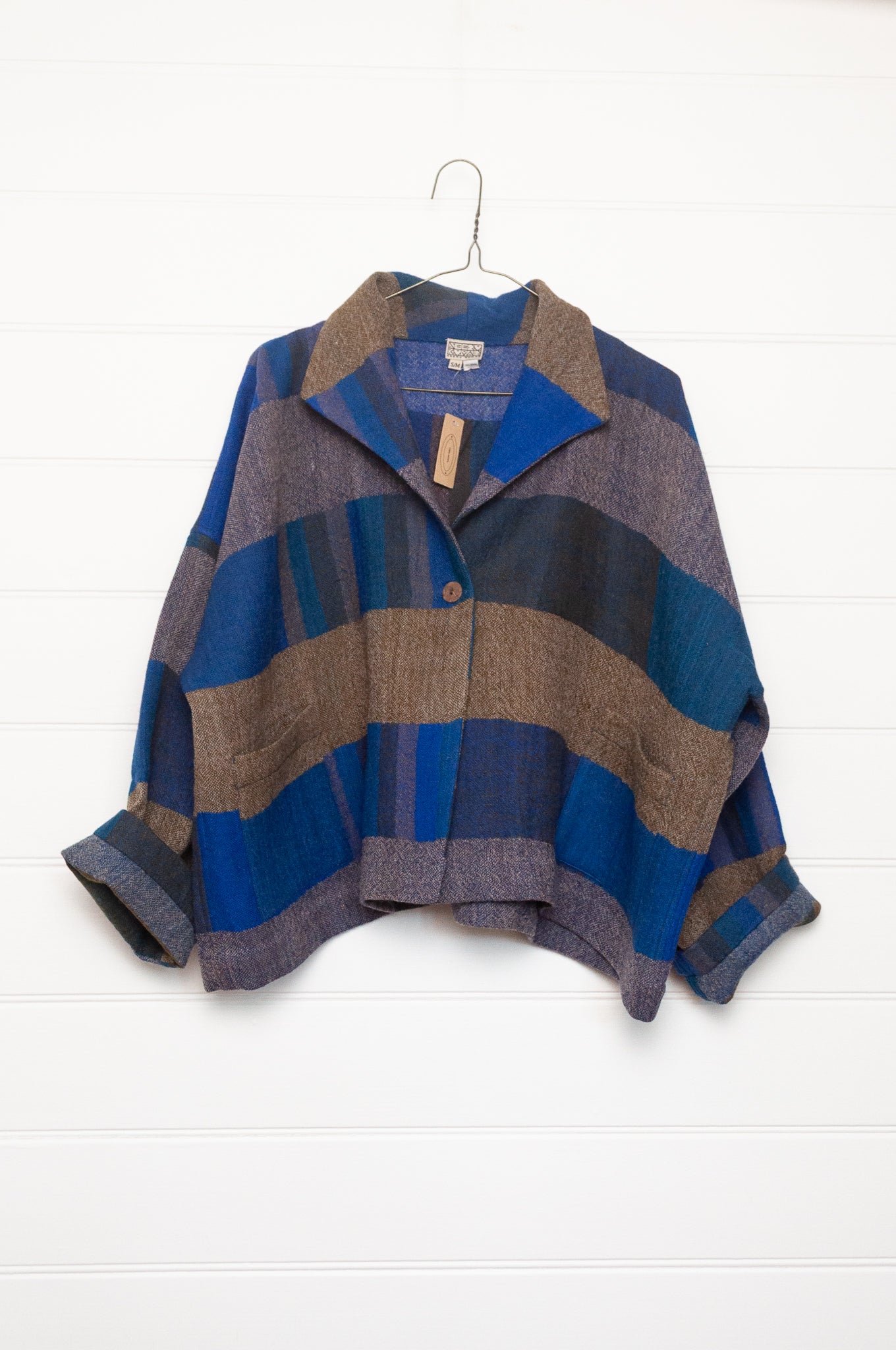 Neeru Kumar handwoven wool Coco jackt in block blanket checks in grey brown, cobalt, teal and navy.