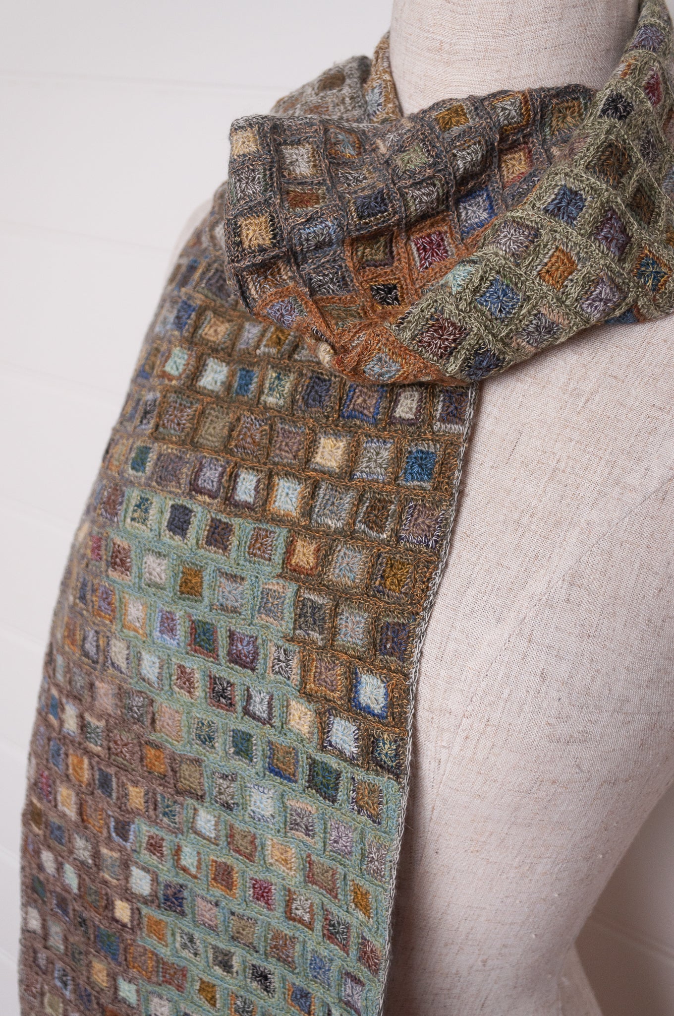 Sophie Digard crocheted wool and linen scarf multi-coloured patches in Moss palette.