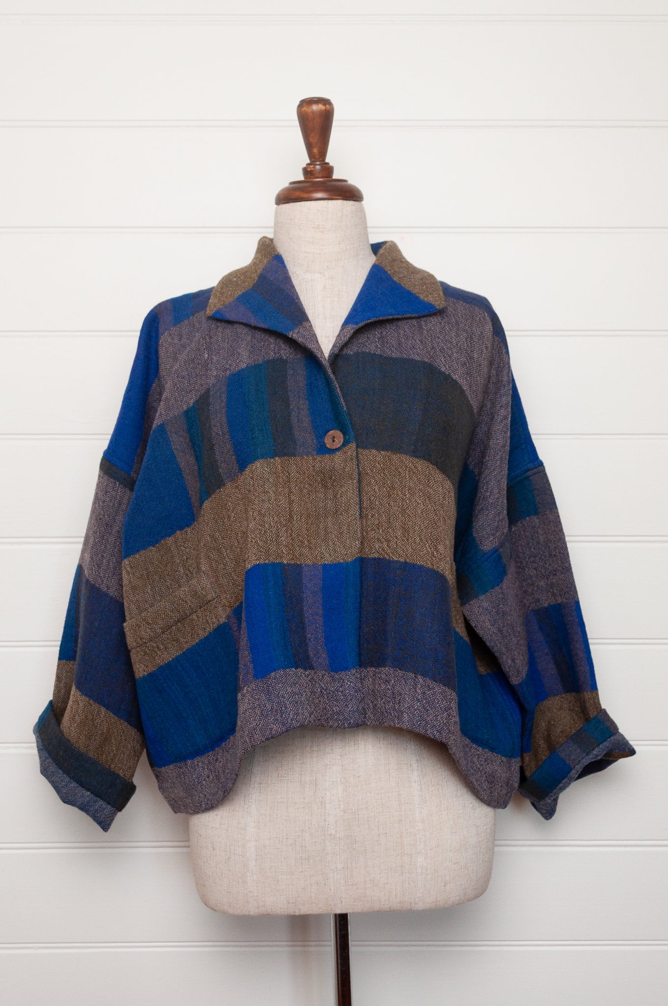 Neeru Kumar handwoven wool Coco jackt in block blanket checks in grey brown, cobalt, teal and navy.
