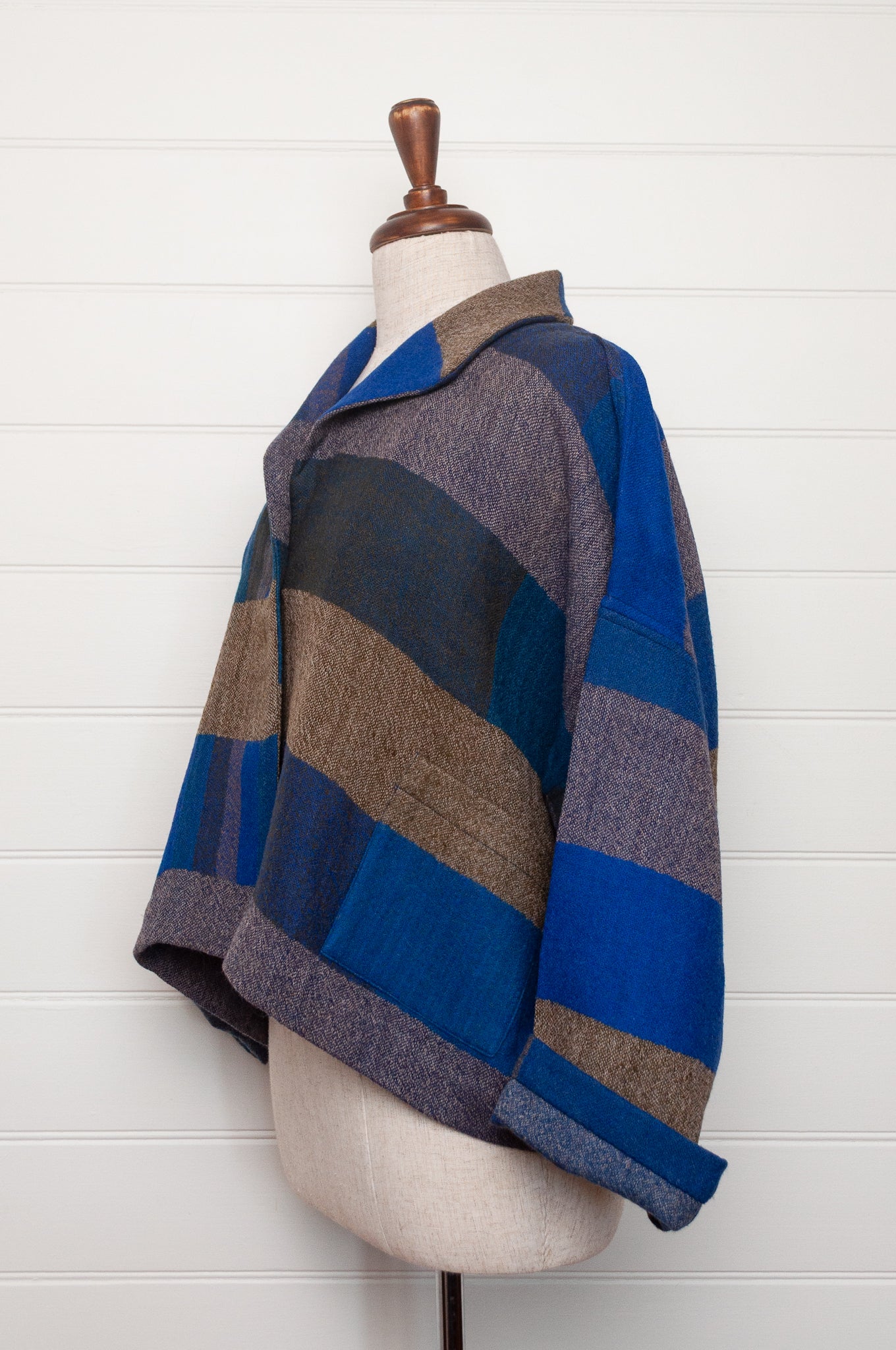Neeru Kumar handwoven wool Coco jackt in block blanket checks in grey brown, cobalt, teal and navy.