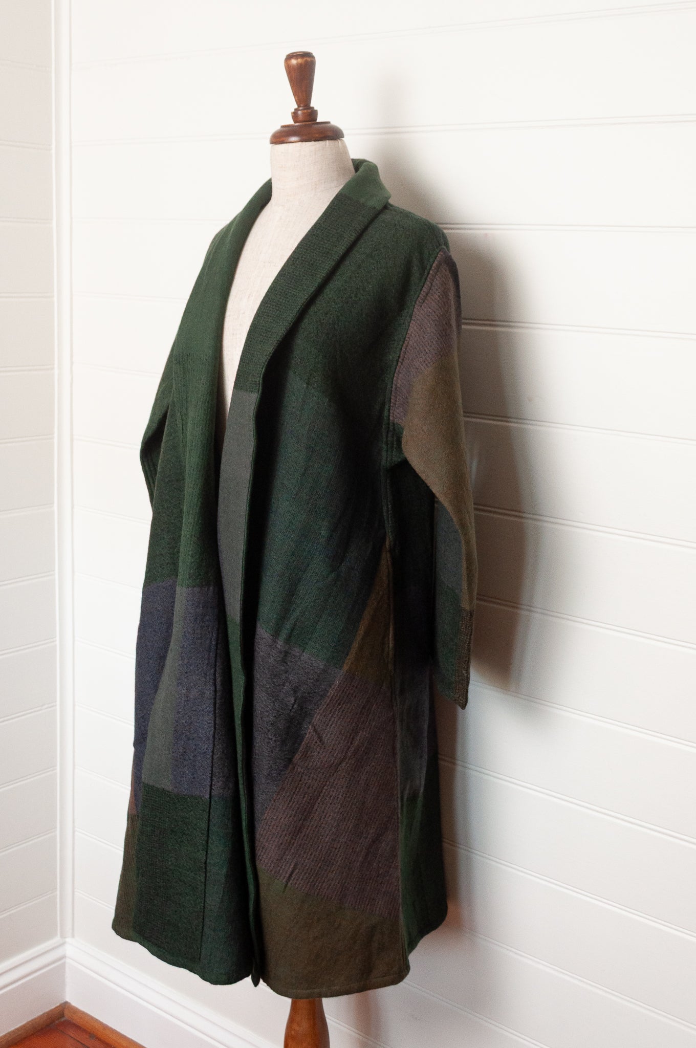 Neeru Kumar handwoven wool cardigan jacket coat in multicolor block pattern of browns and greens.