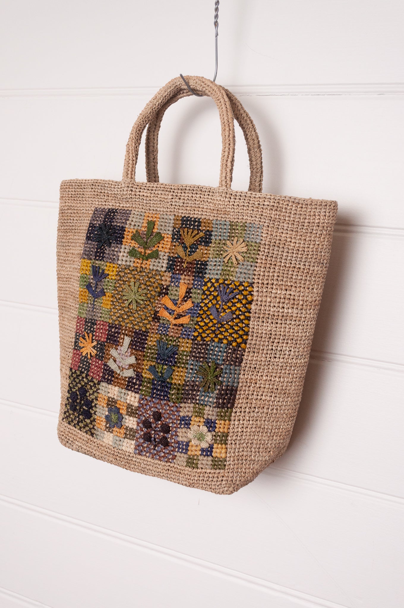 Sophie Digard crochet raffiab ag with embroidered floral patchwork panel.