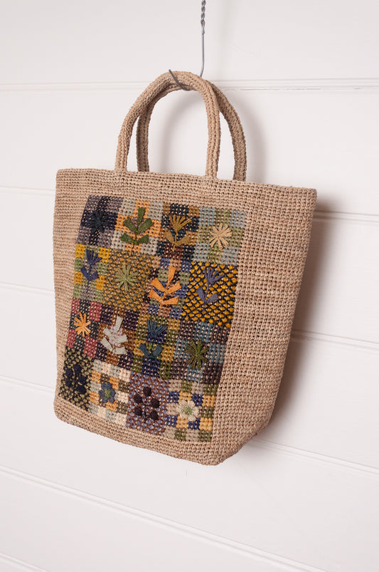 Sophie Digard crochet raffiab ag with embroidered floral patchwork panel.