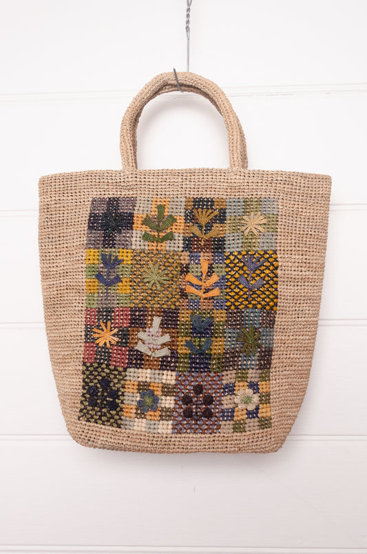 Sophie Digard crochet raffiab ag with embroidered floral patchwork panel.