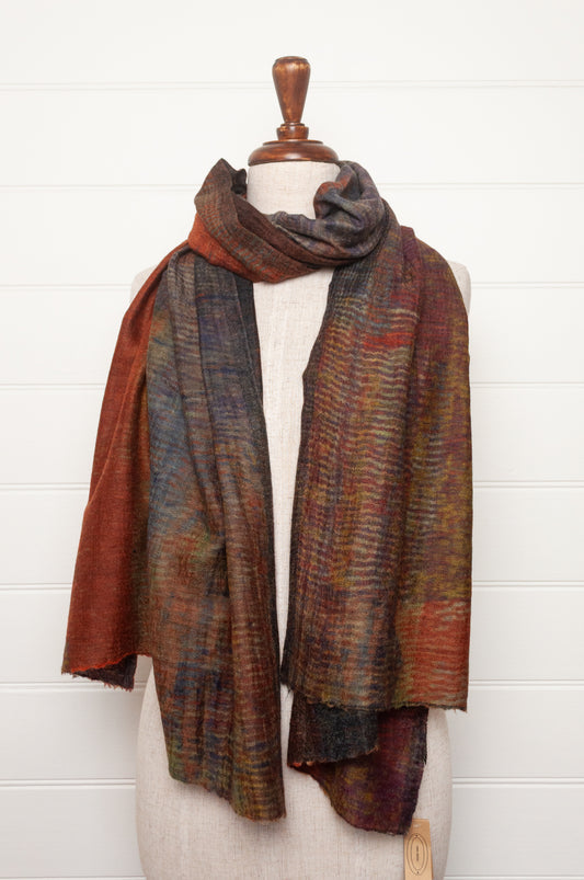 Neeru Kumar fine wool scarf digital print in abstract design with tones of rust, blue, charcoal and brown.